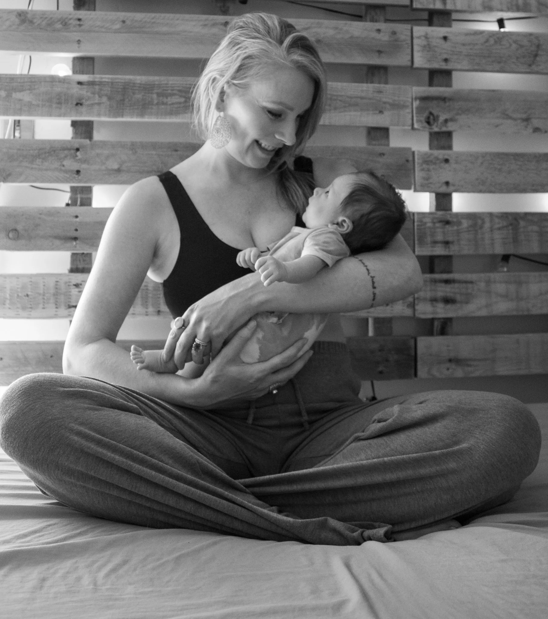 Mother holding newborn baby during postpartum period
