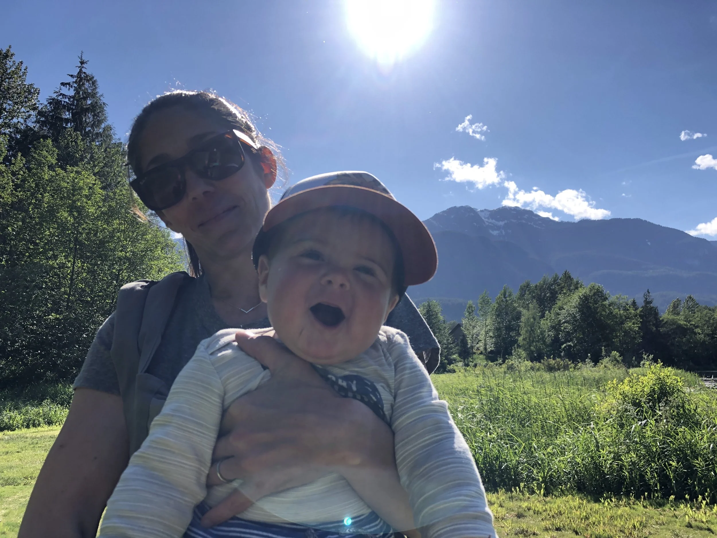 Mother holding her baby outdoors in Squamish, BC