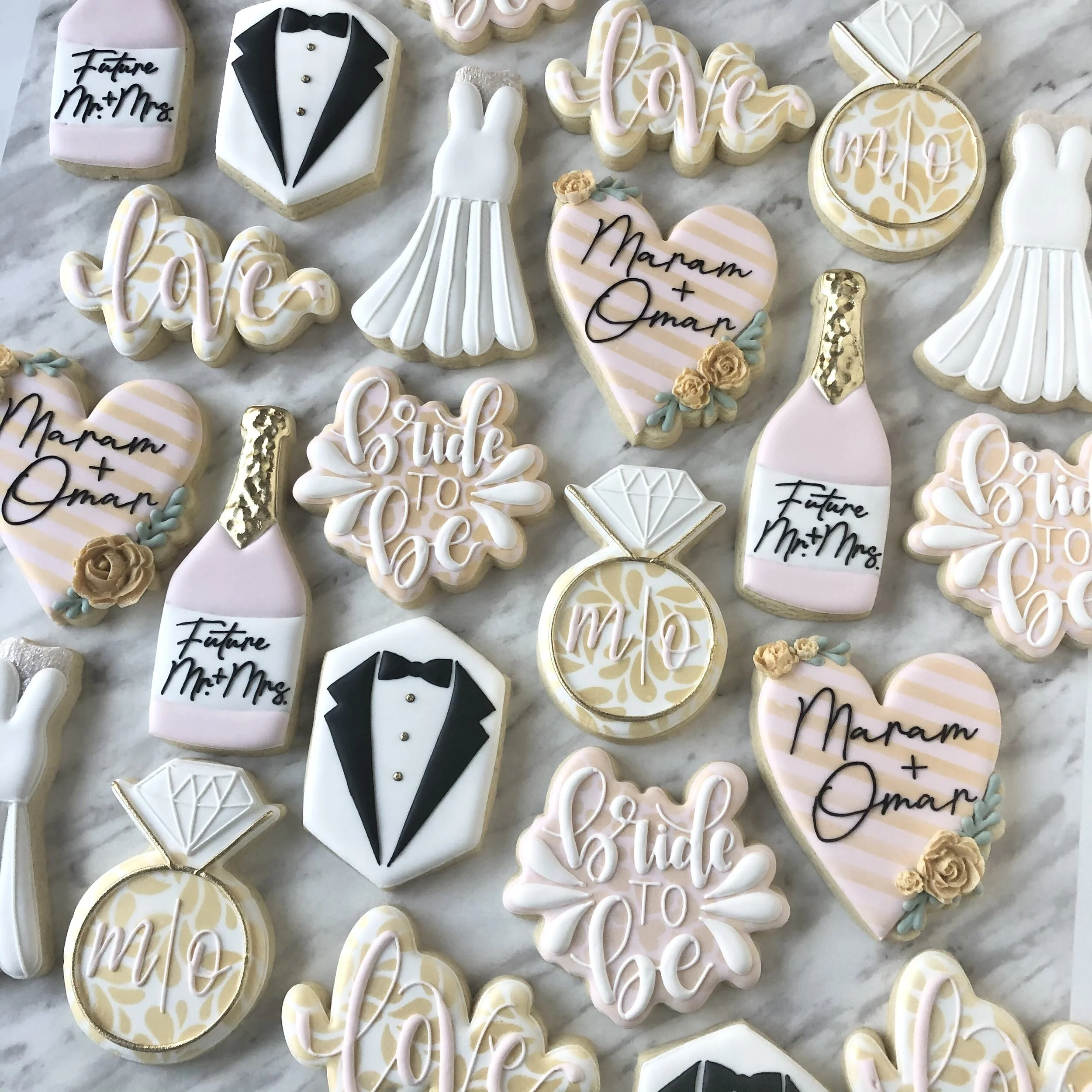 Custom wedding themed handmade decorated cookies with phrases 'Future Mr & Mrs,' 'Bride to Be,' shaped as hearts, bridal dresses, champagne bottles, and rings. Unique fancy cookies for a special day.