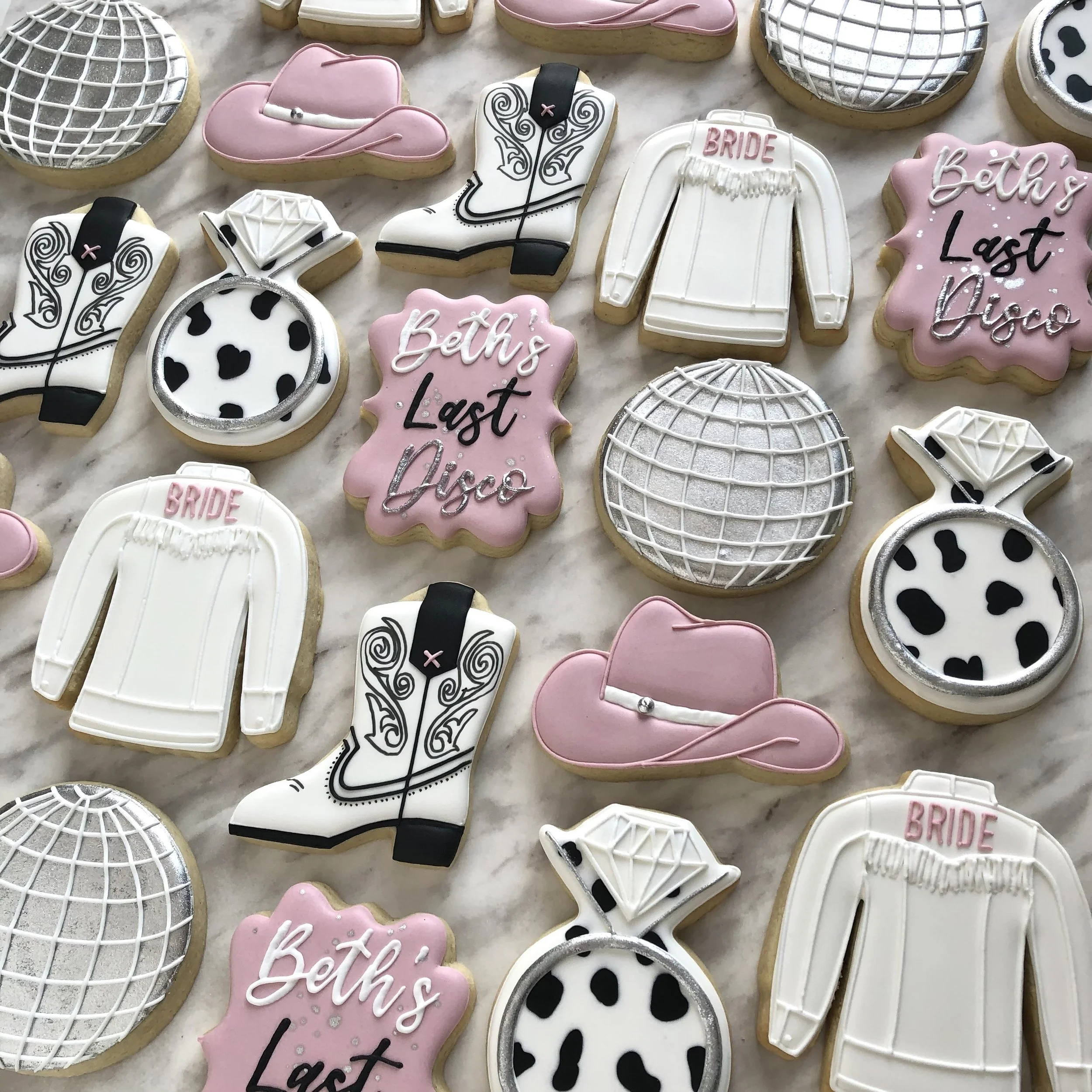 Custom personalized bachelorette cookies with cowboy hats, cowgirl jackets, Western boots, horseshoes, disco balls, and cow print. Handmade locally with the best quality ingredients.