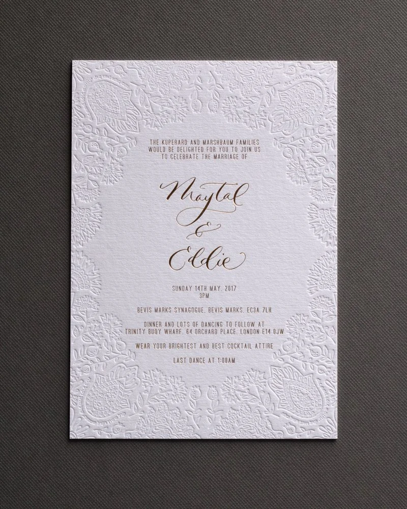 Hot foil and blind deboss wedding invitations.