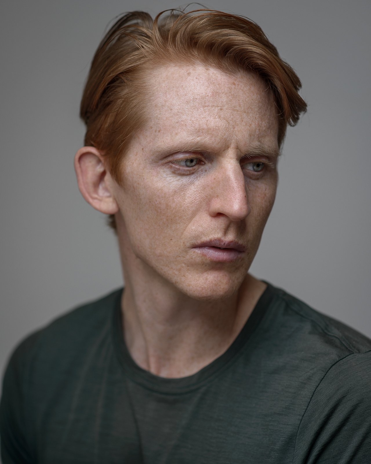 Professional cinematic headshot of a male actor with red hair for a Cape Town casting portfolio.
