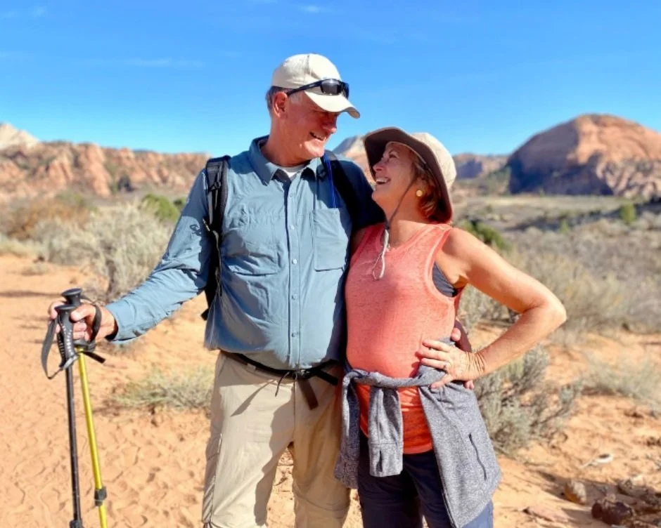A man and women smile at each other during Zion hiking tour