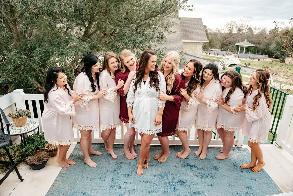 Bride getting ready on location with her bridesmaids at Inn at Quarry Ridge wedding venue