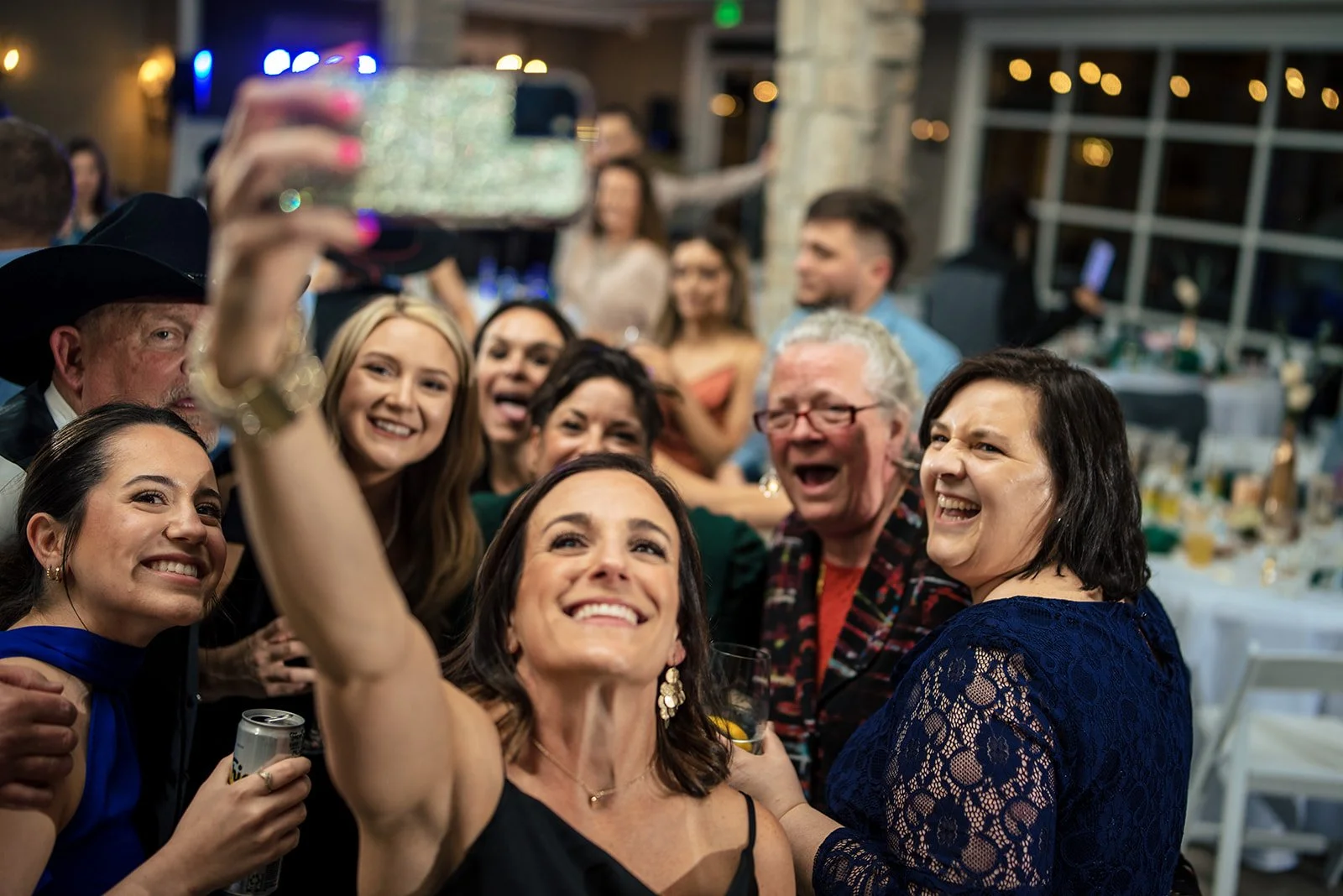 Wedding guests celebrate and dance together at Stonehem Hall in College Station Texas