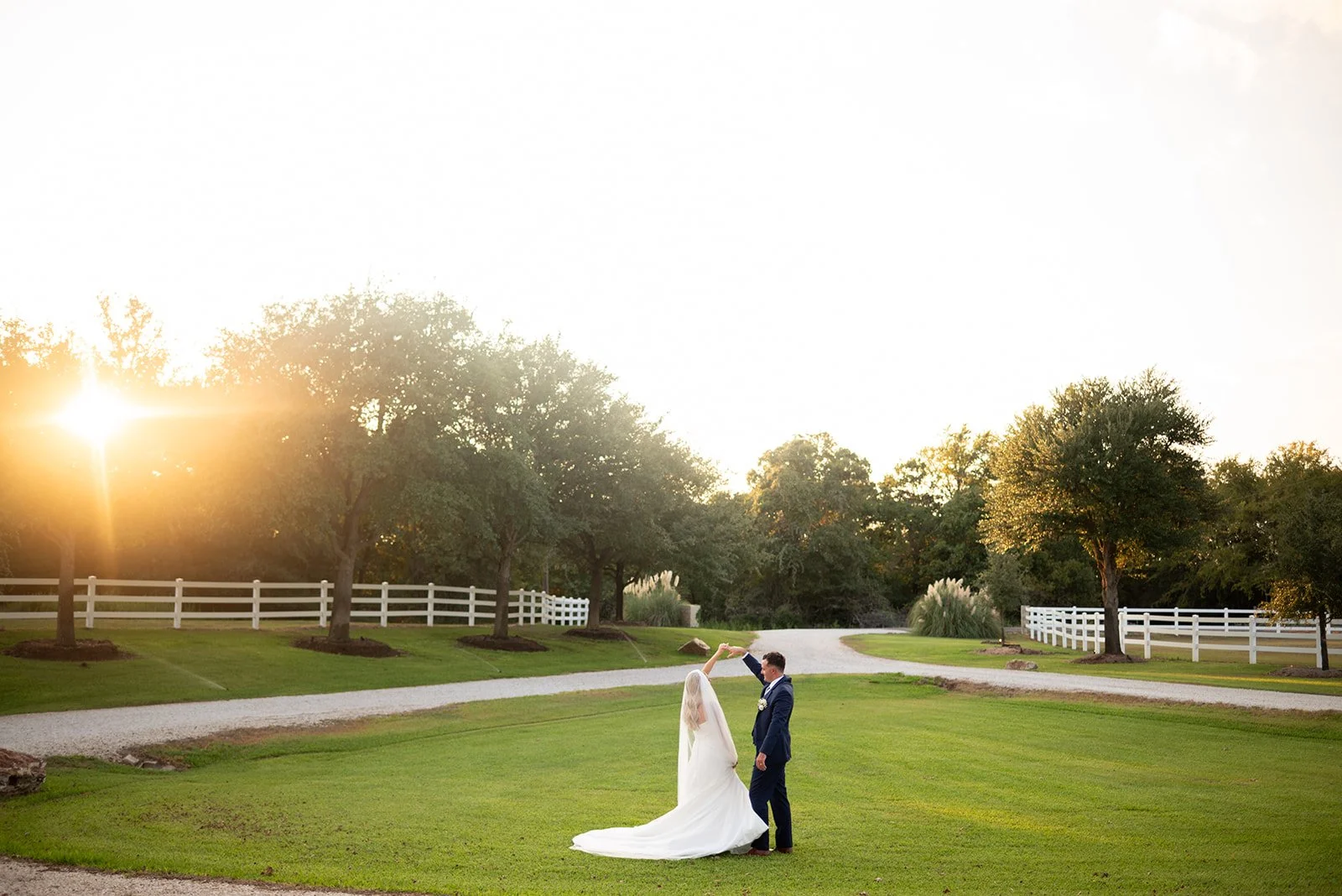 Cameron and Makenzie explore scenic venue together after their ceremony in Bryan TX