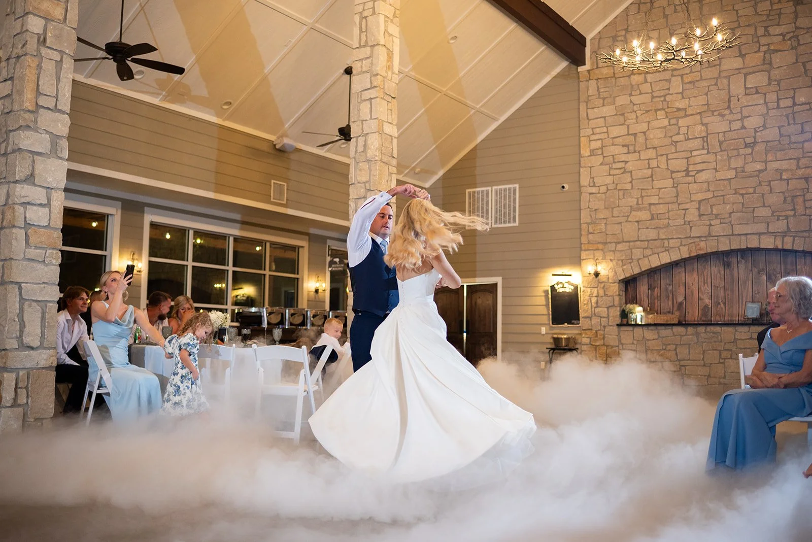 Cameron and Makenzie sharing their first dance surrounded by a romantic cloud of smoke in Stonehem Hall