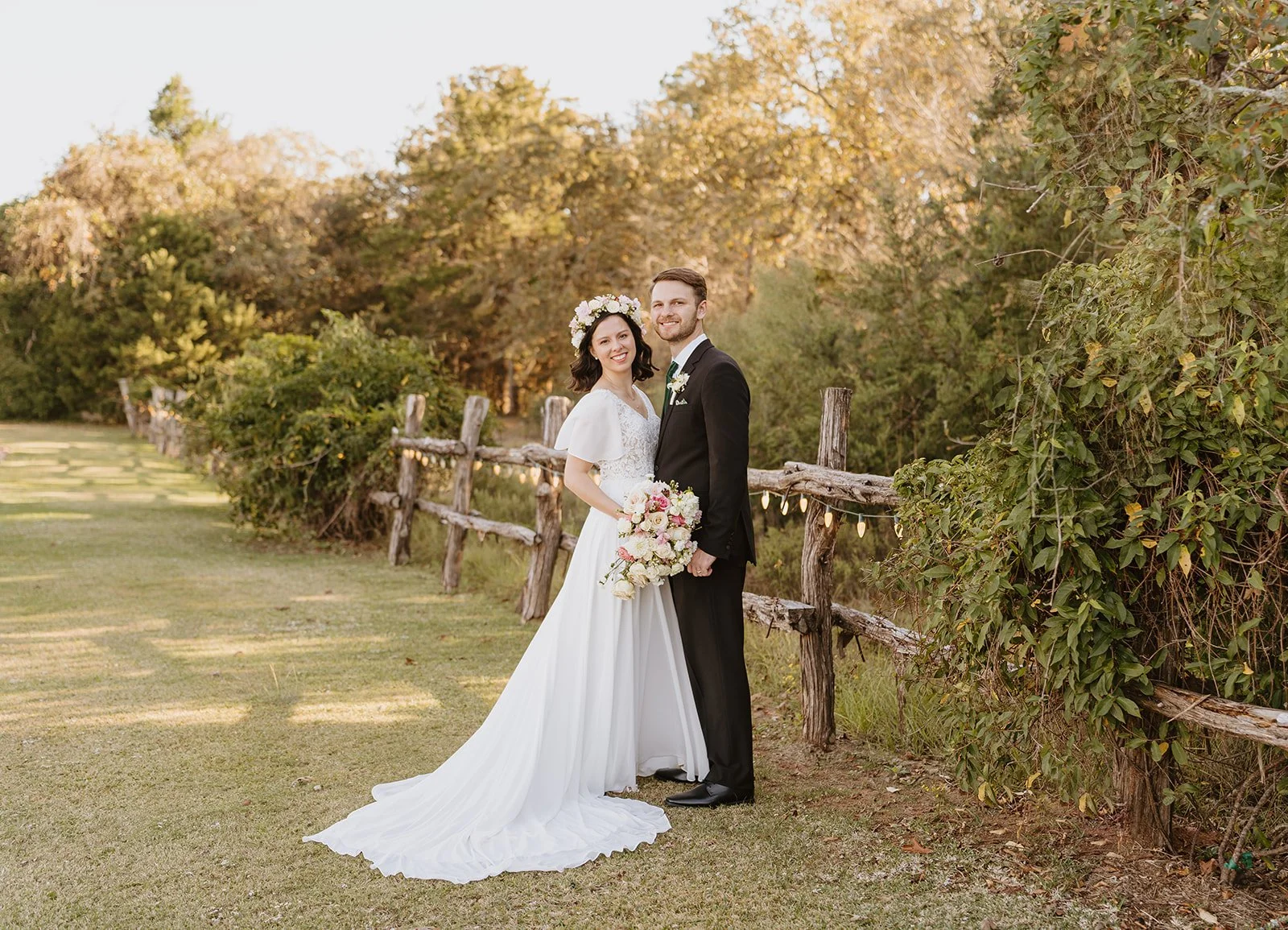 Bride and groom next to the pond at The Inn at Quarry Ridge in College Station, Texas