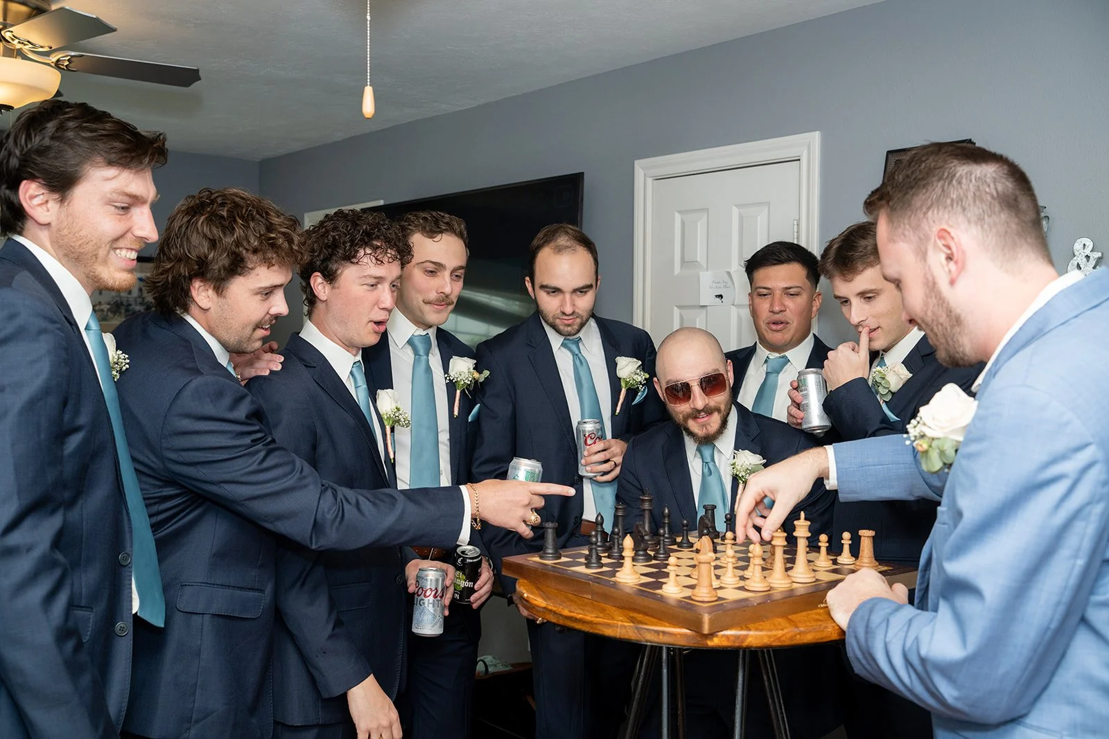 Groom and groomsmen get ready at Inn at Quarry Ridge and play chess