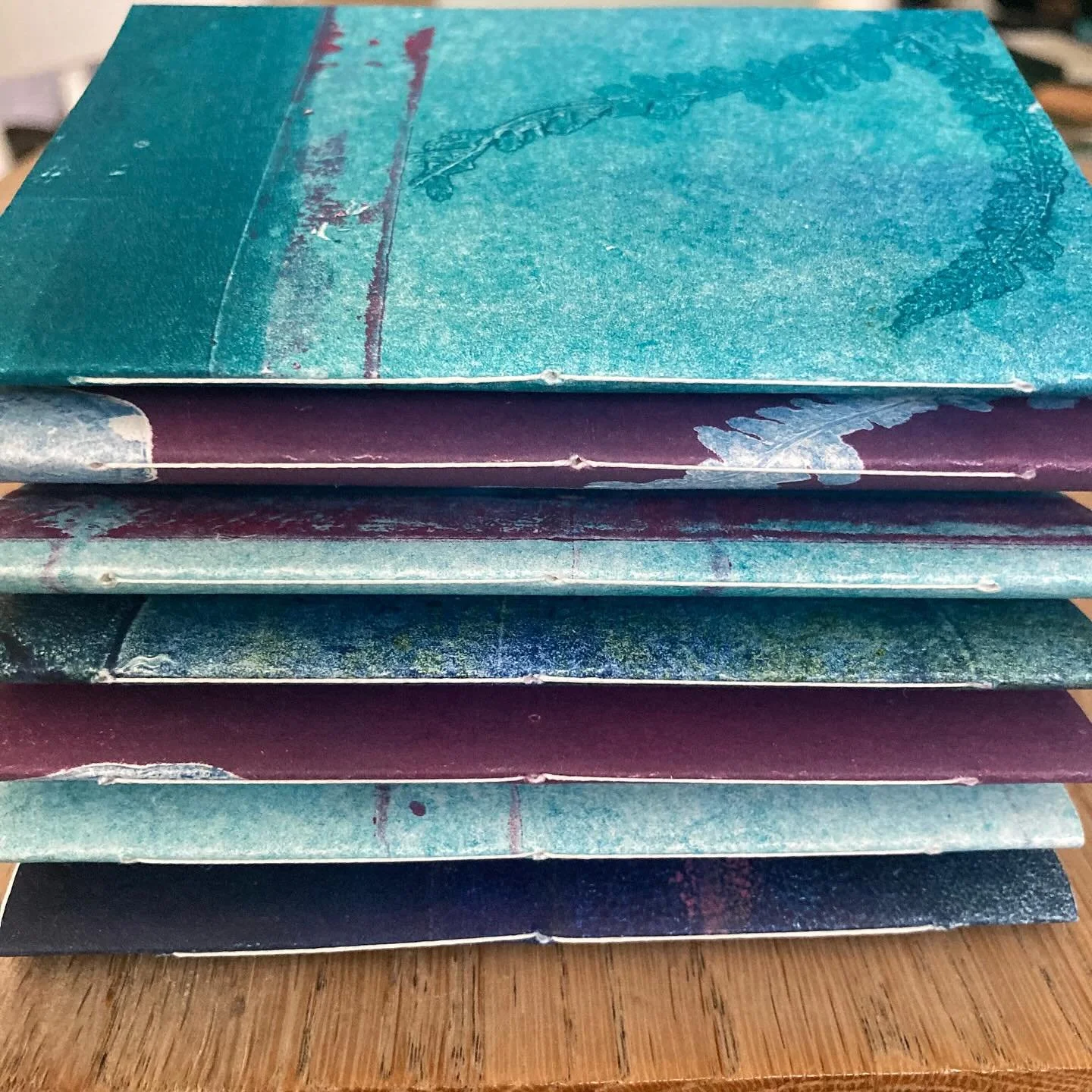 I always feel a sense of achievement when I&rsquo;ve completed a little stack of notebooks!  Some of these mini notebooks, along with my printmaking artwork will be available at Bath Contemporary Artists Fair this Sunday 9th November at Green Park St