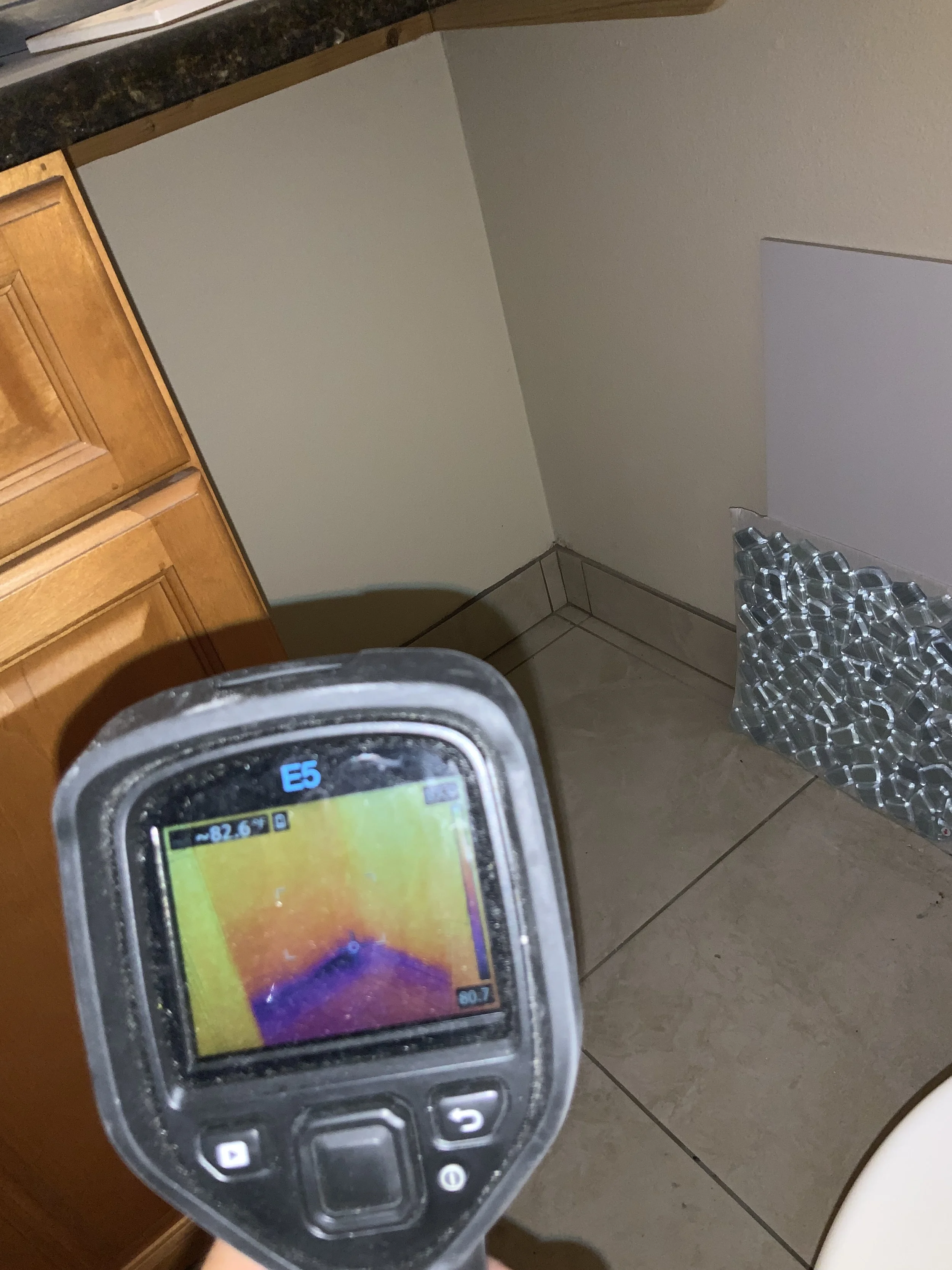Florida Mold Testing technician using thermal imaging camera during mold inspection in Volusia County FL