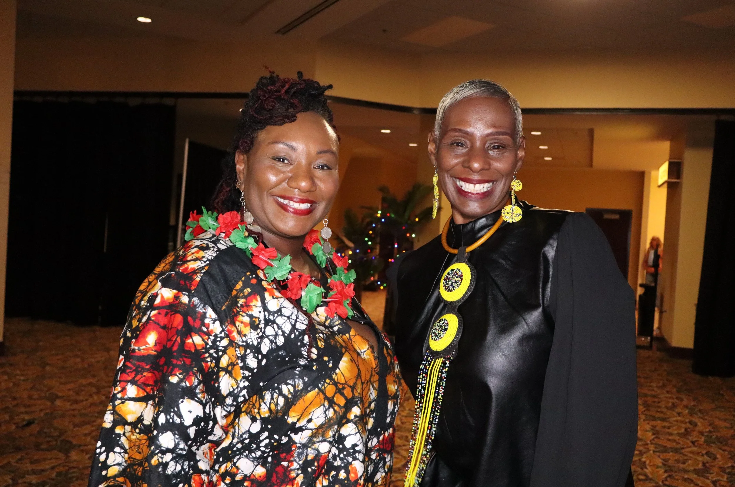 Women smile roaming photo booth OKC