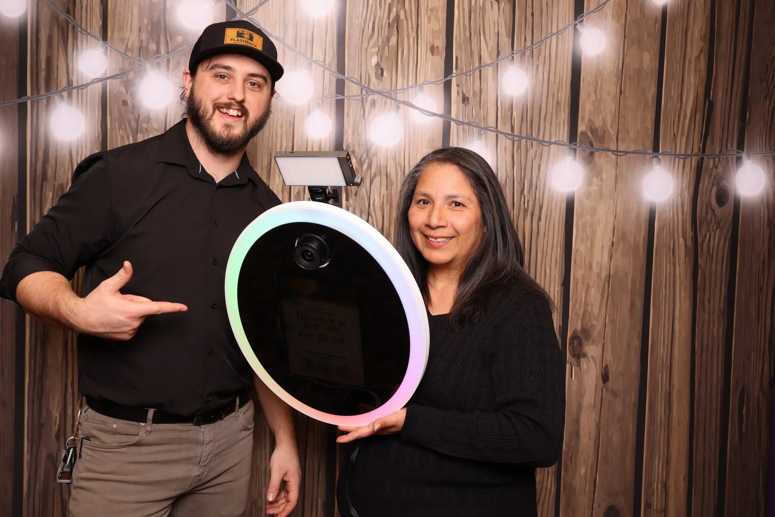 Employees pose with roaming photo booth OKC