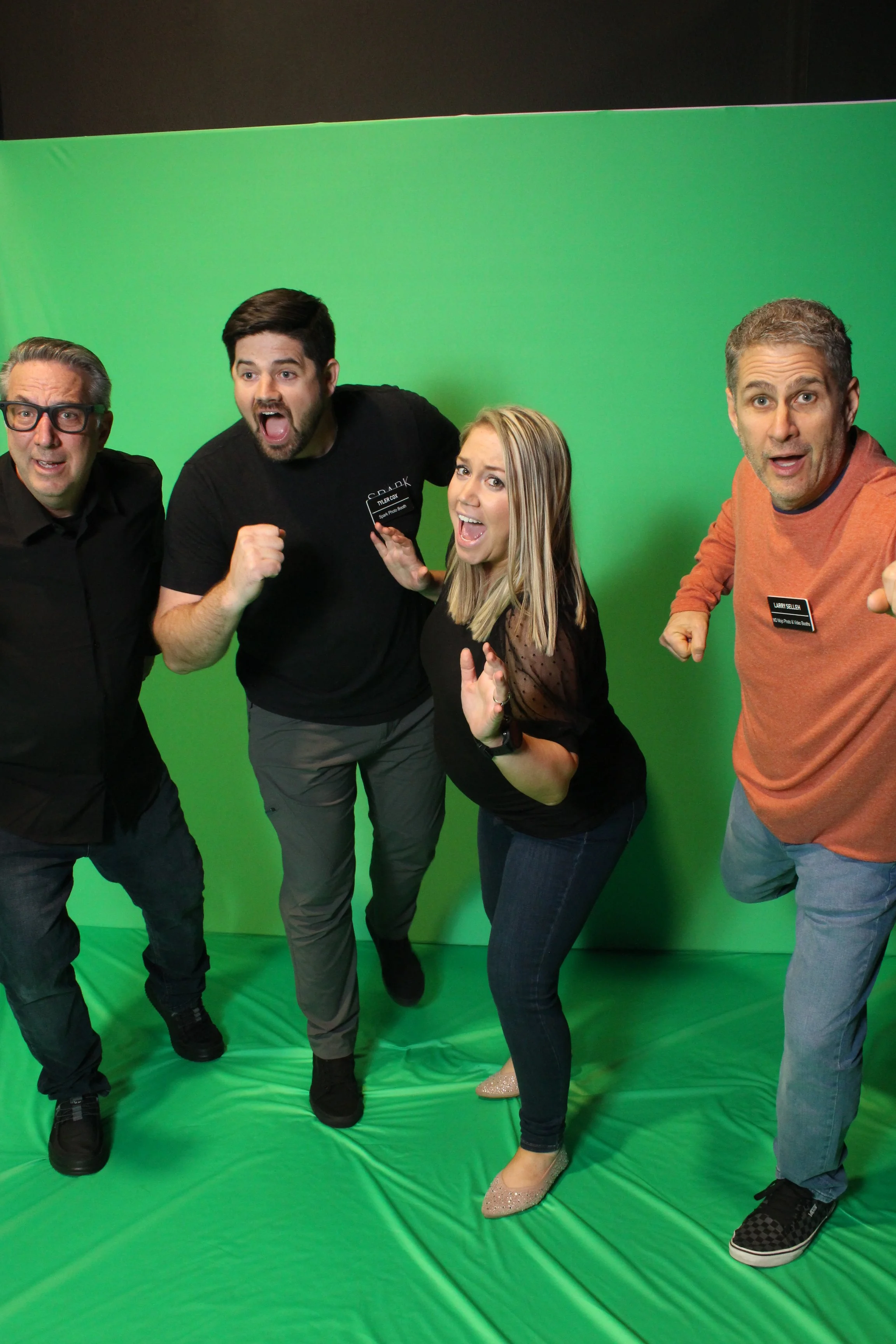 Four guests posing for green screen photo booth in Oklahoma City
