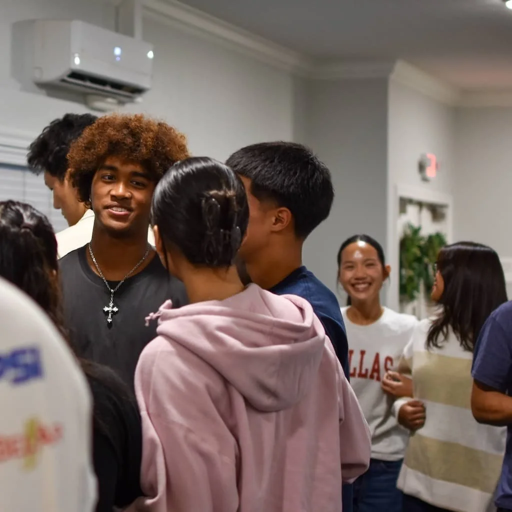 Campus Light college ministry students connecting at a Friday night