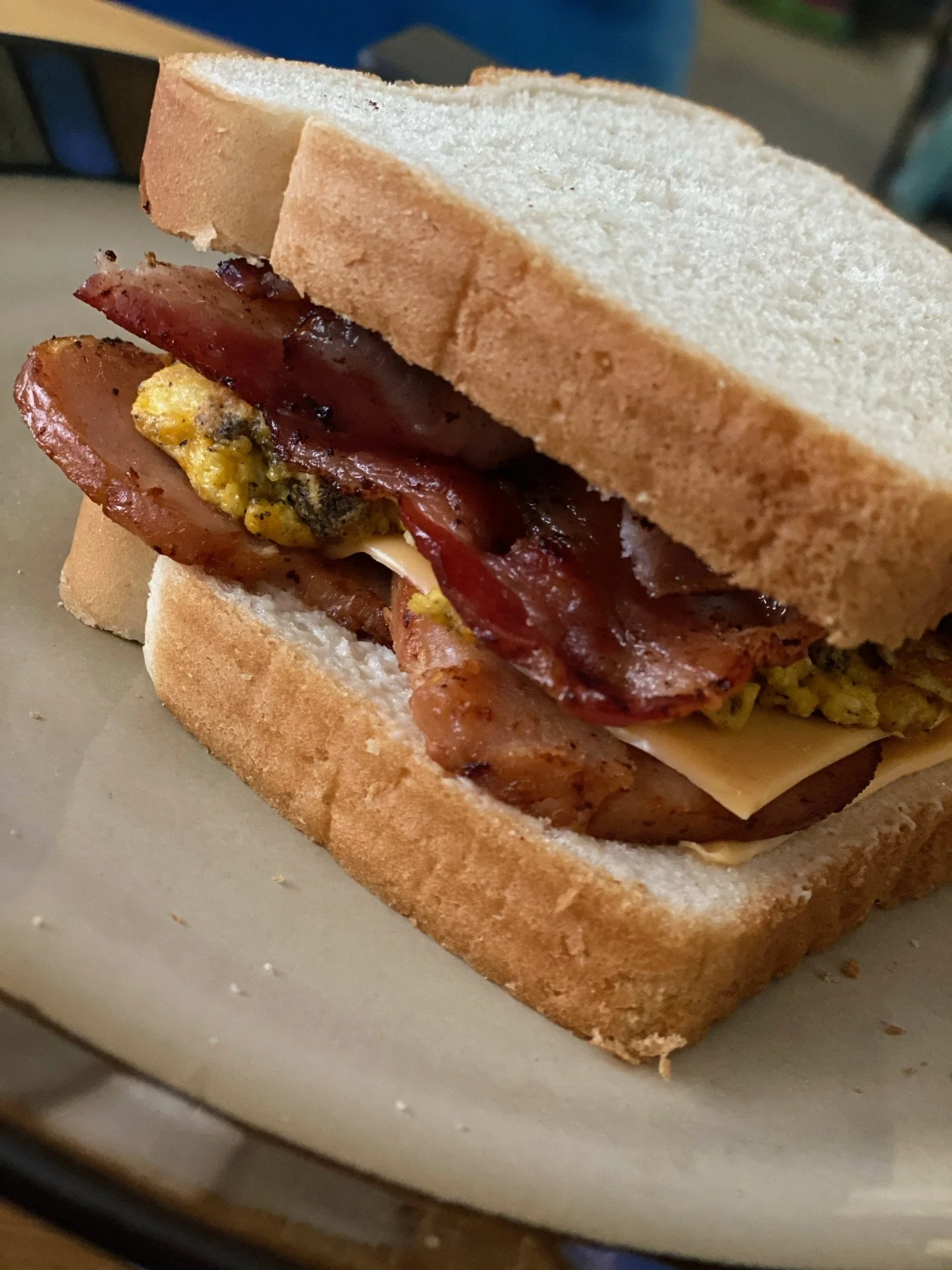 Breakfast Sandwich with bacon, sausage and eggs 