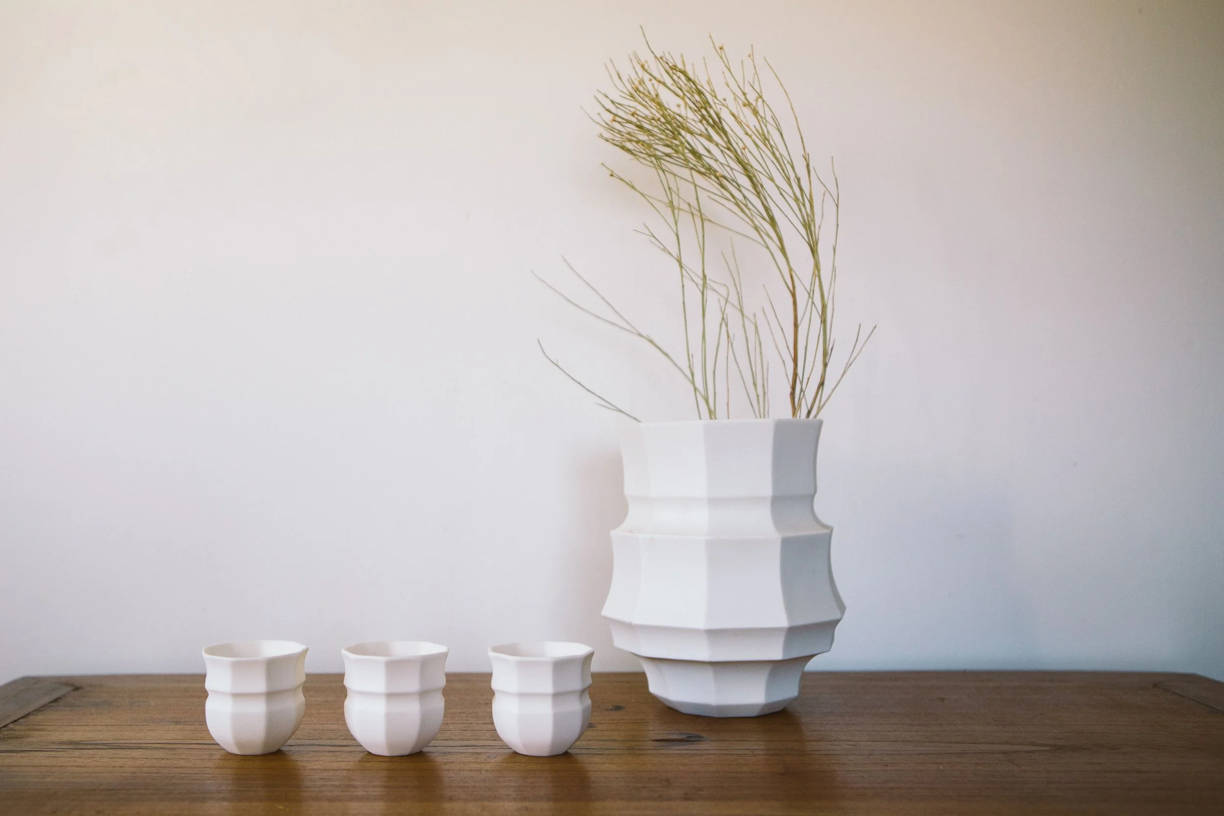 Large porcelain lantern and ceramic votives for home and patio ambience