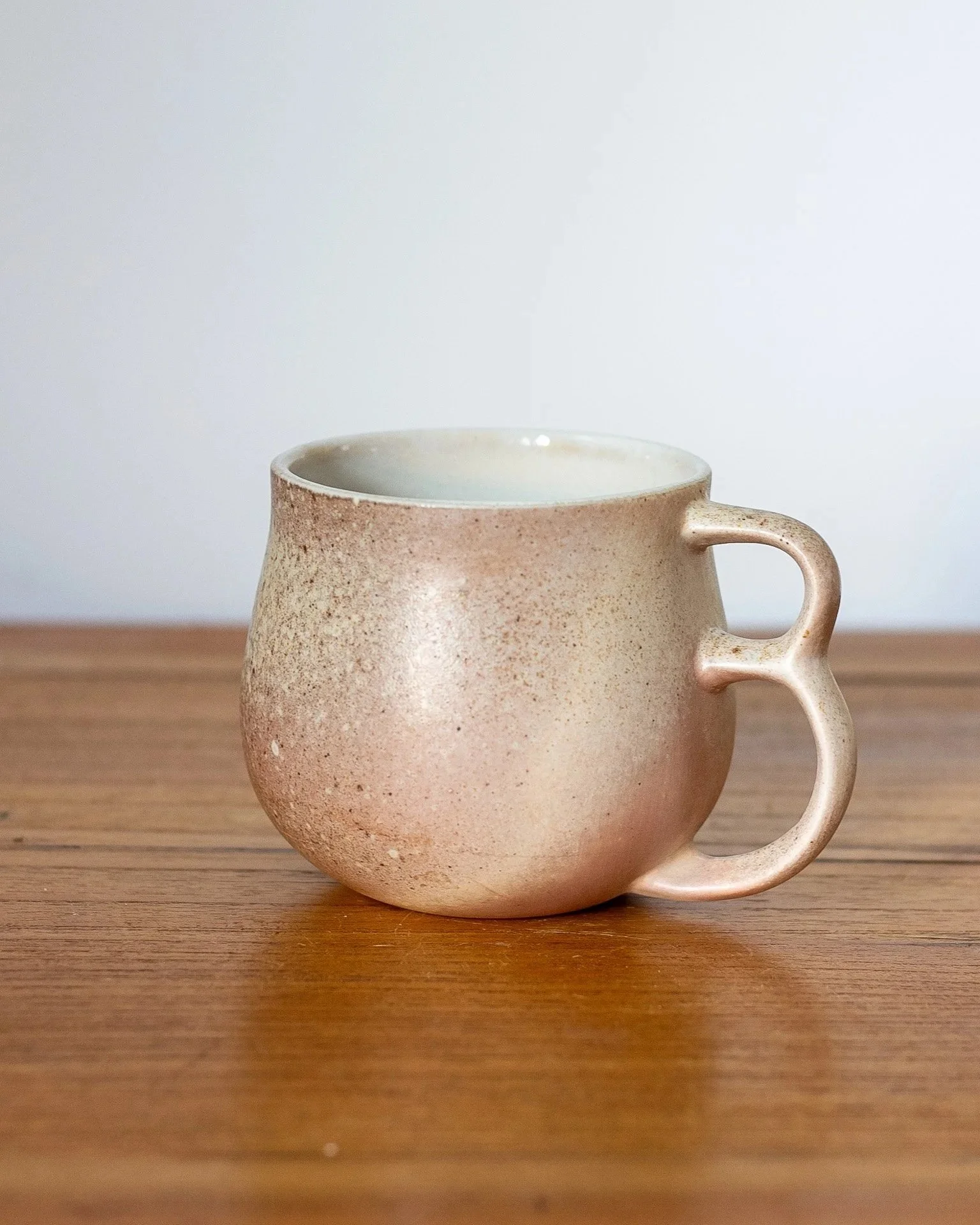Handmade wood fired Double Handle porcelain mug made in Bisbee Arizona.