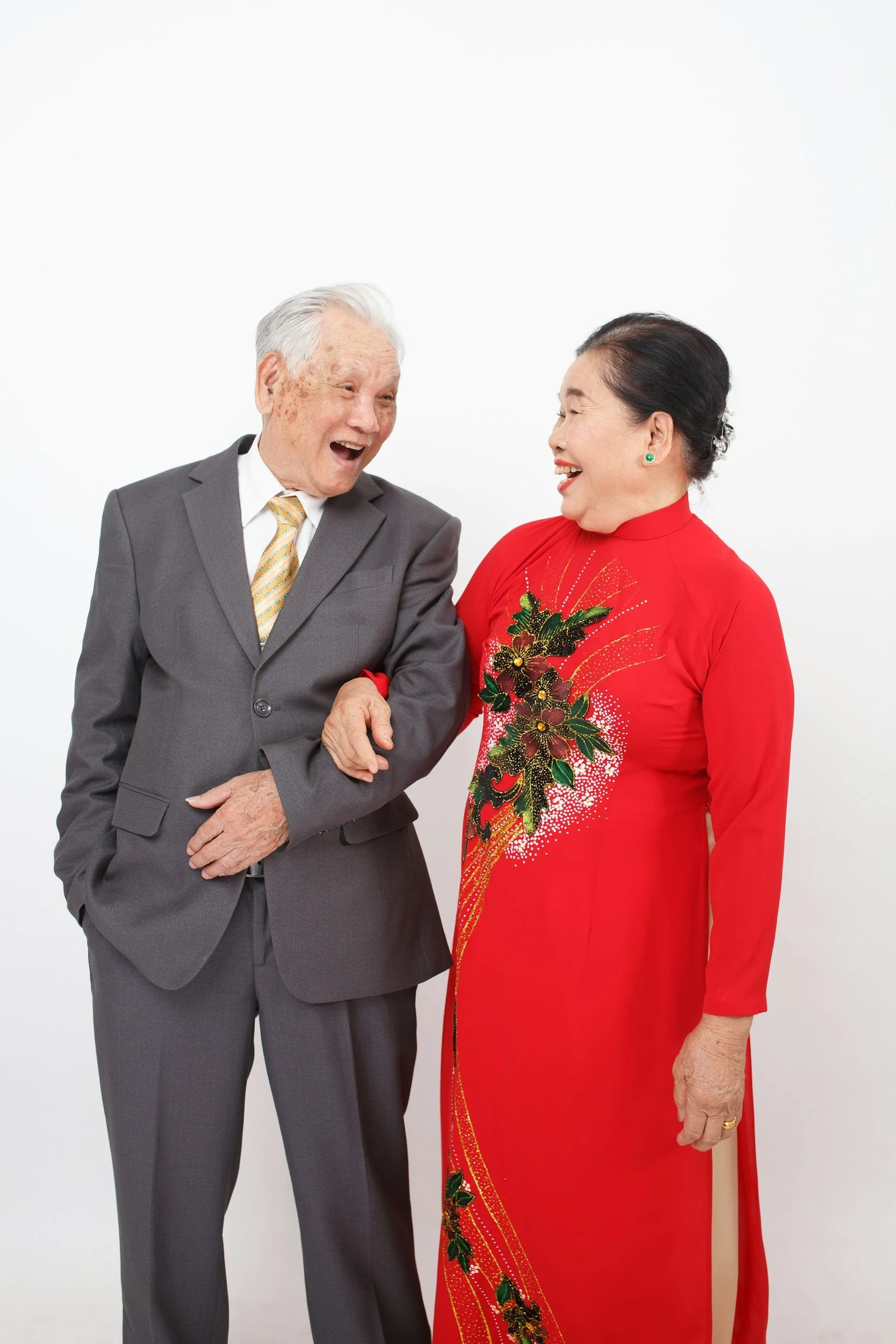 old smiling couple not wearing glasses