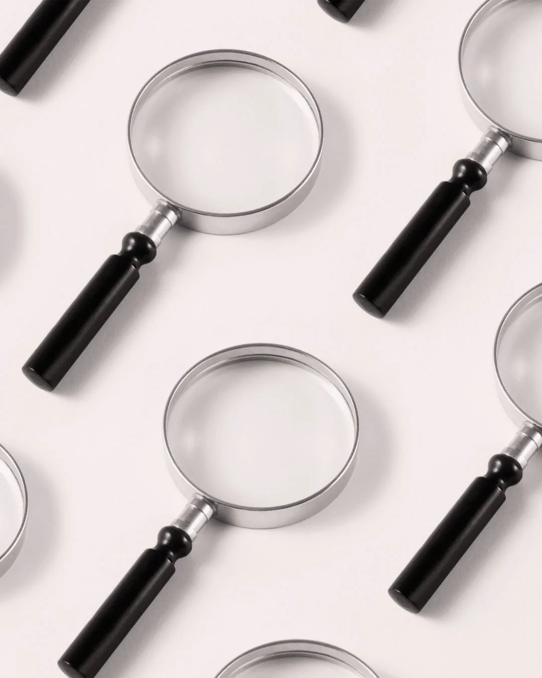 Magnifying glass pattern symbolizing visibility and search, used to promote a business visibility mini-course on optimizing Google, Apple, and social profiles.