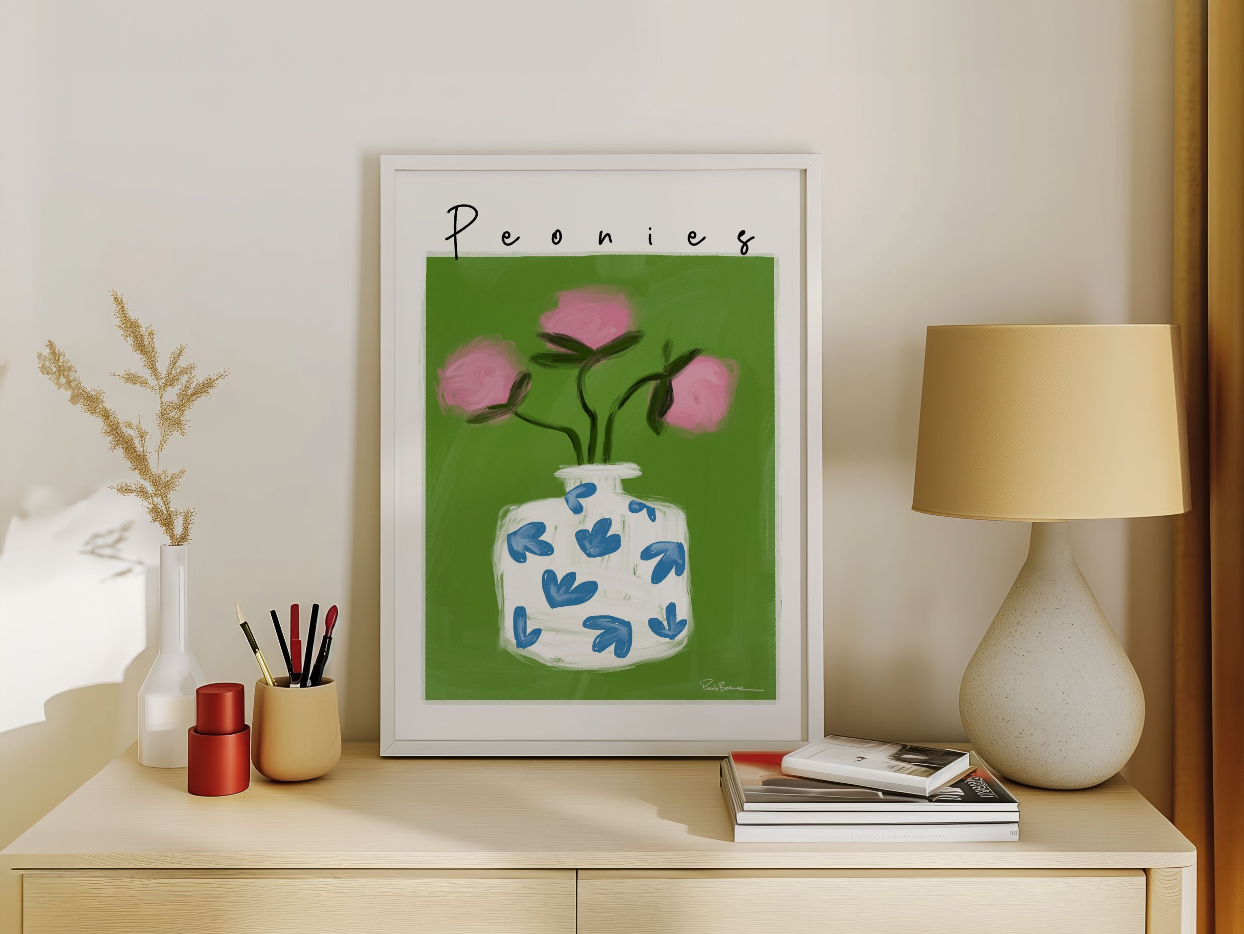 Botanical art print from original painting of pink flowers in white and blue vase with green background framed on a shelf