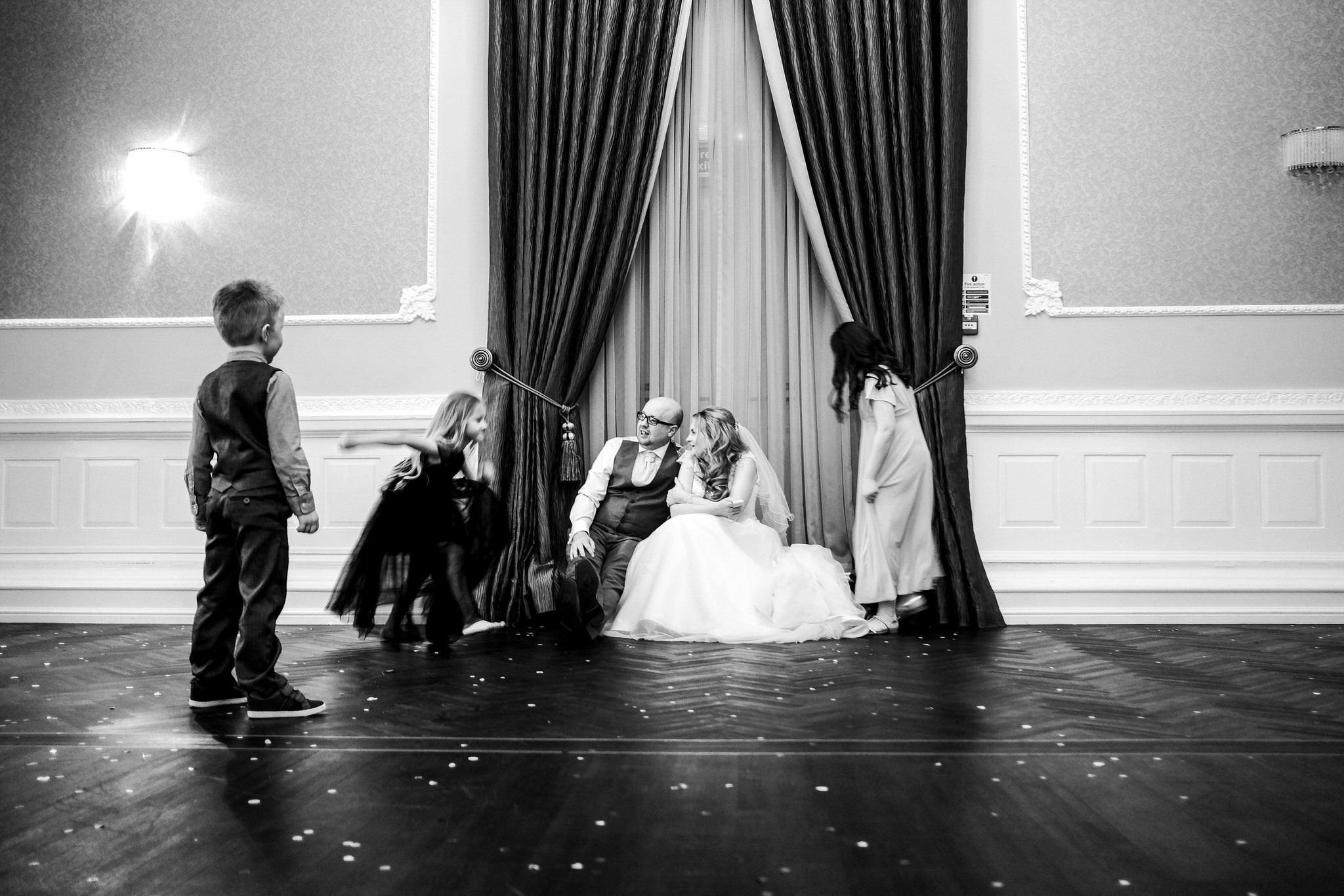 Children surround the bride and groom - Authentic Wedding photography.jpg