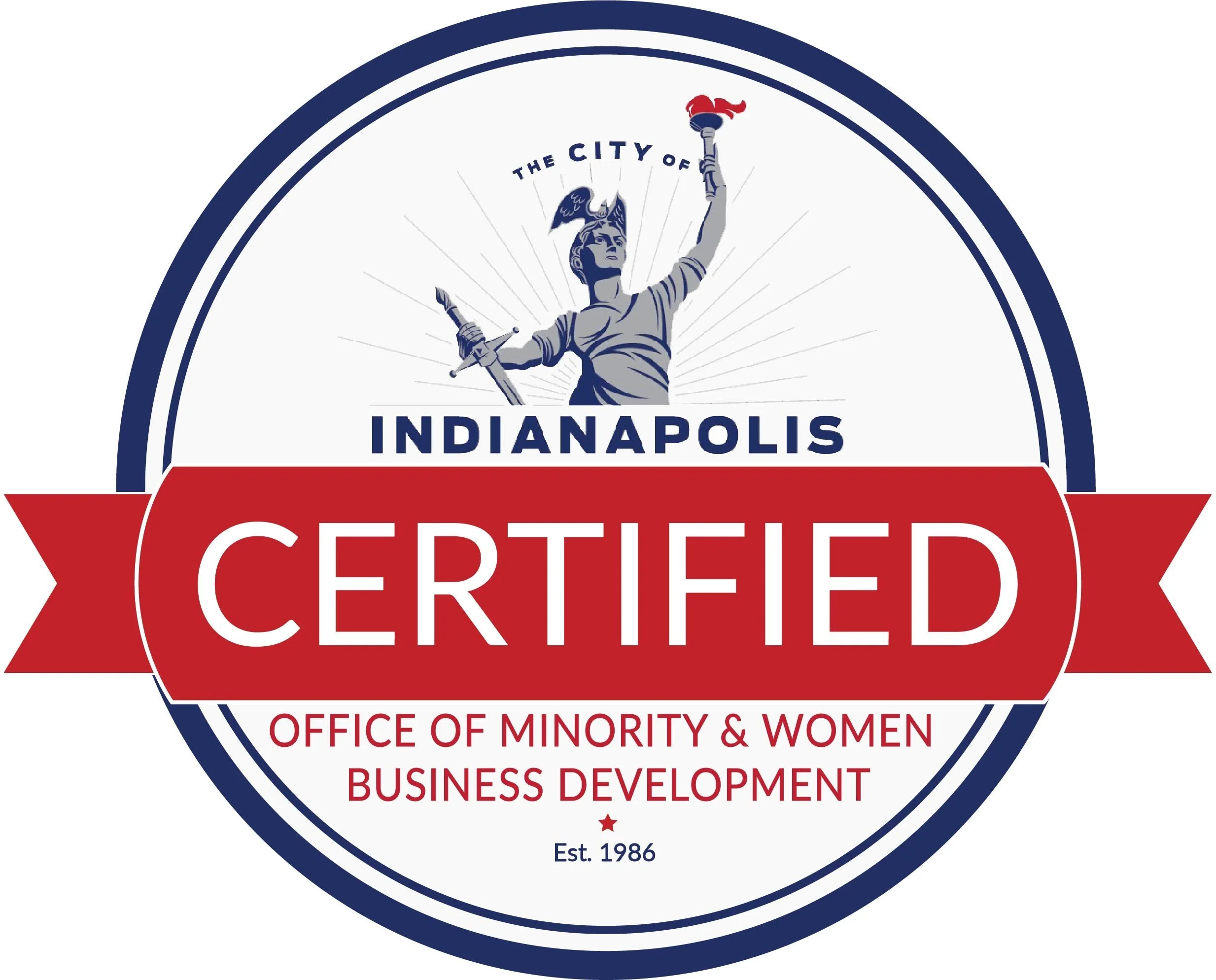 A circular badge with the text 'Indiannapolis Certified Office of Minority & Women Business Development, Est. 1986'. The badge features a depiction of the Statue of Liberty holding a torch and a sword, with red, white, and blue colors.