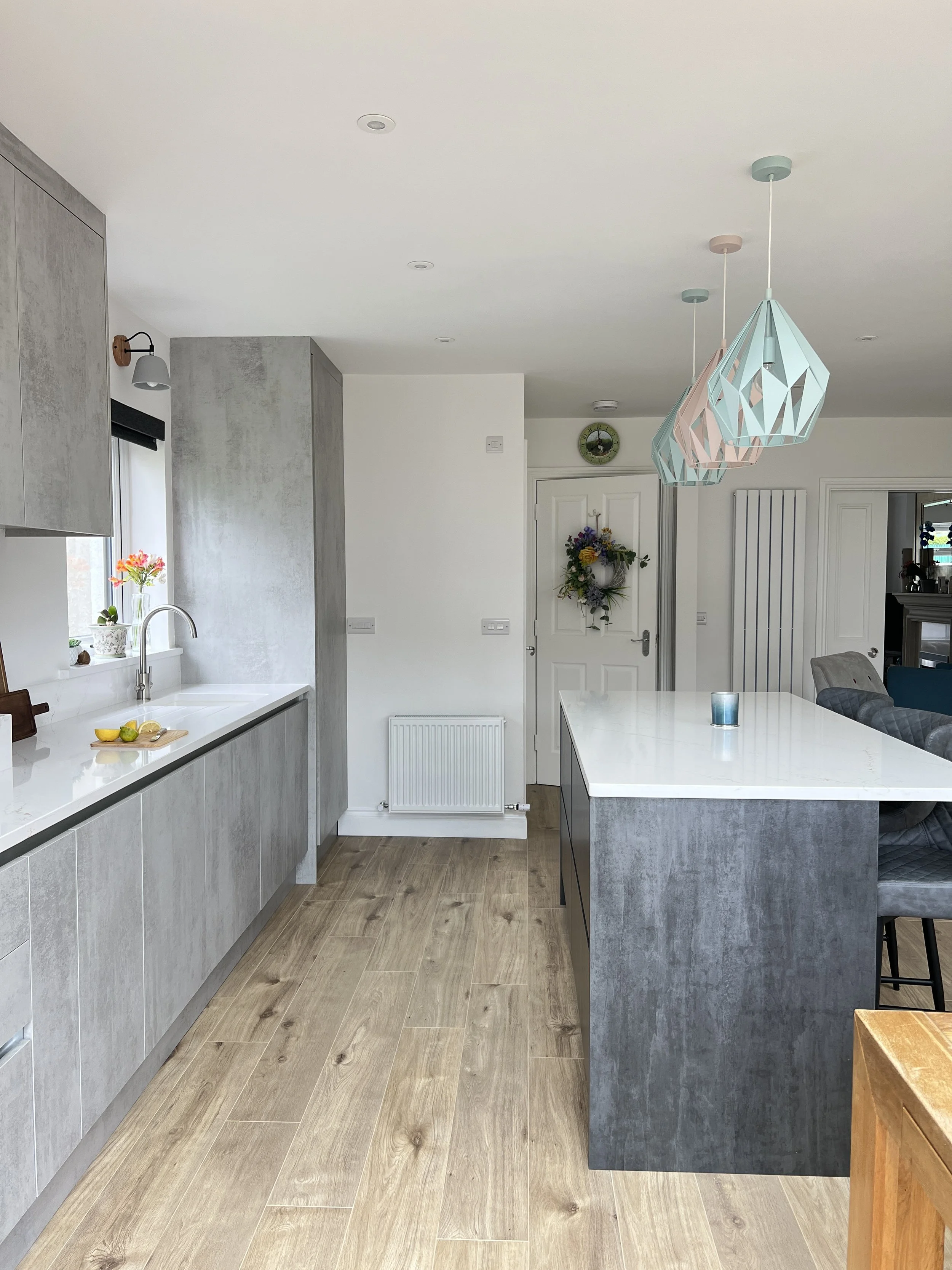 Charcoal grey island with grey cabinets