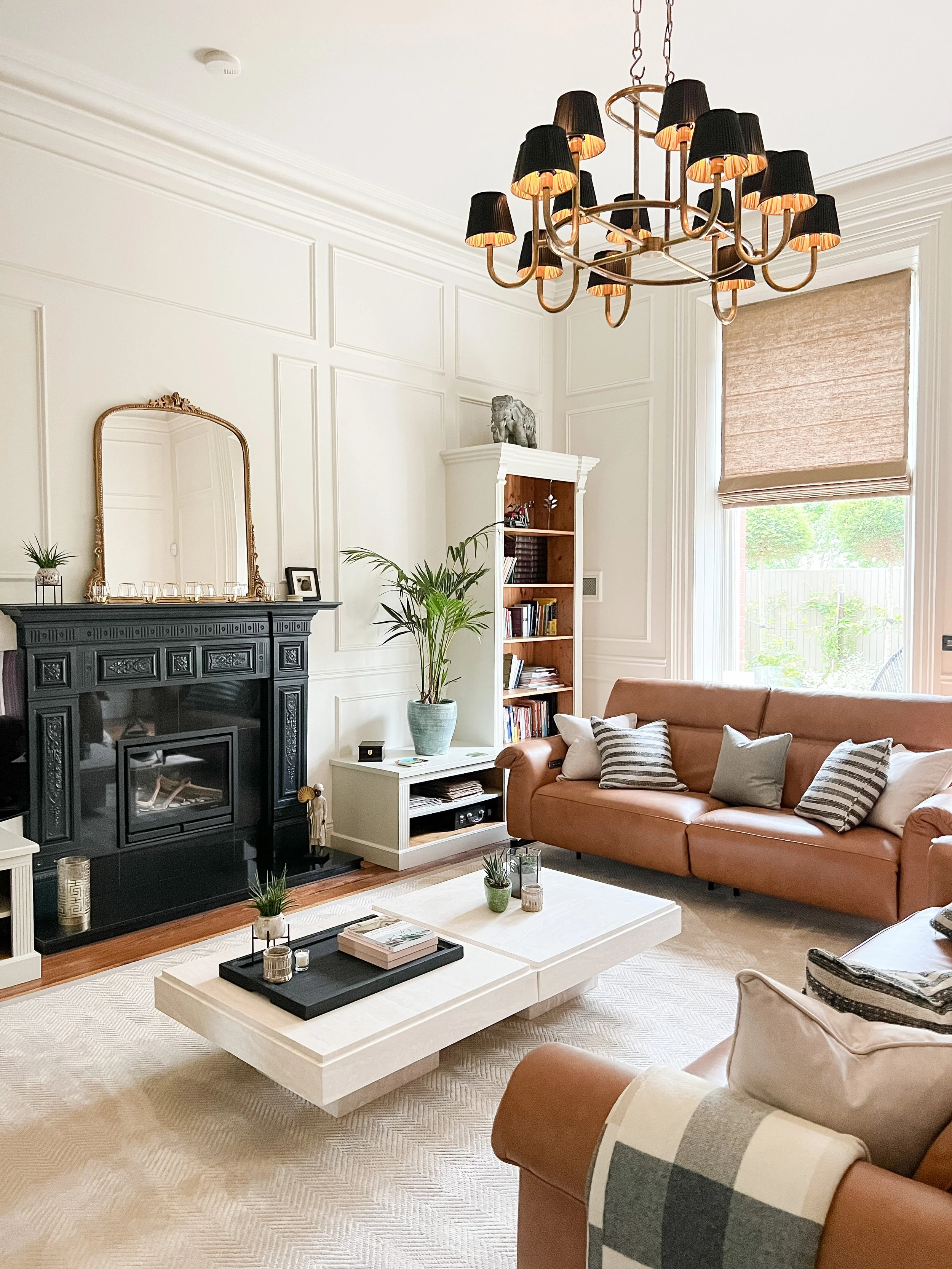 Elegant wall moulding in this spacious living room with high ceiling