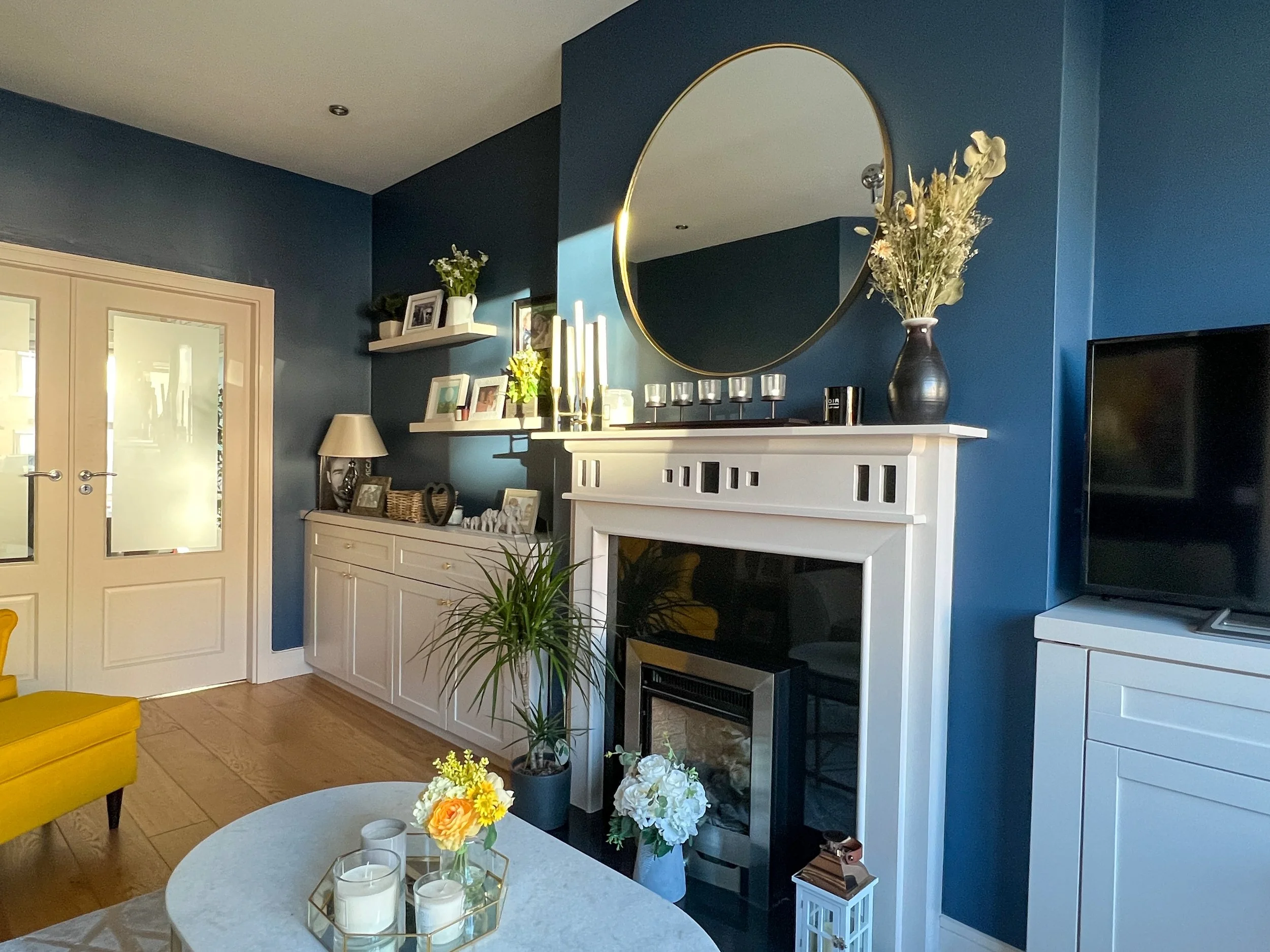 Navy Blue Living Room with Round Gold Mirror 3