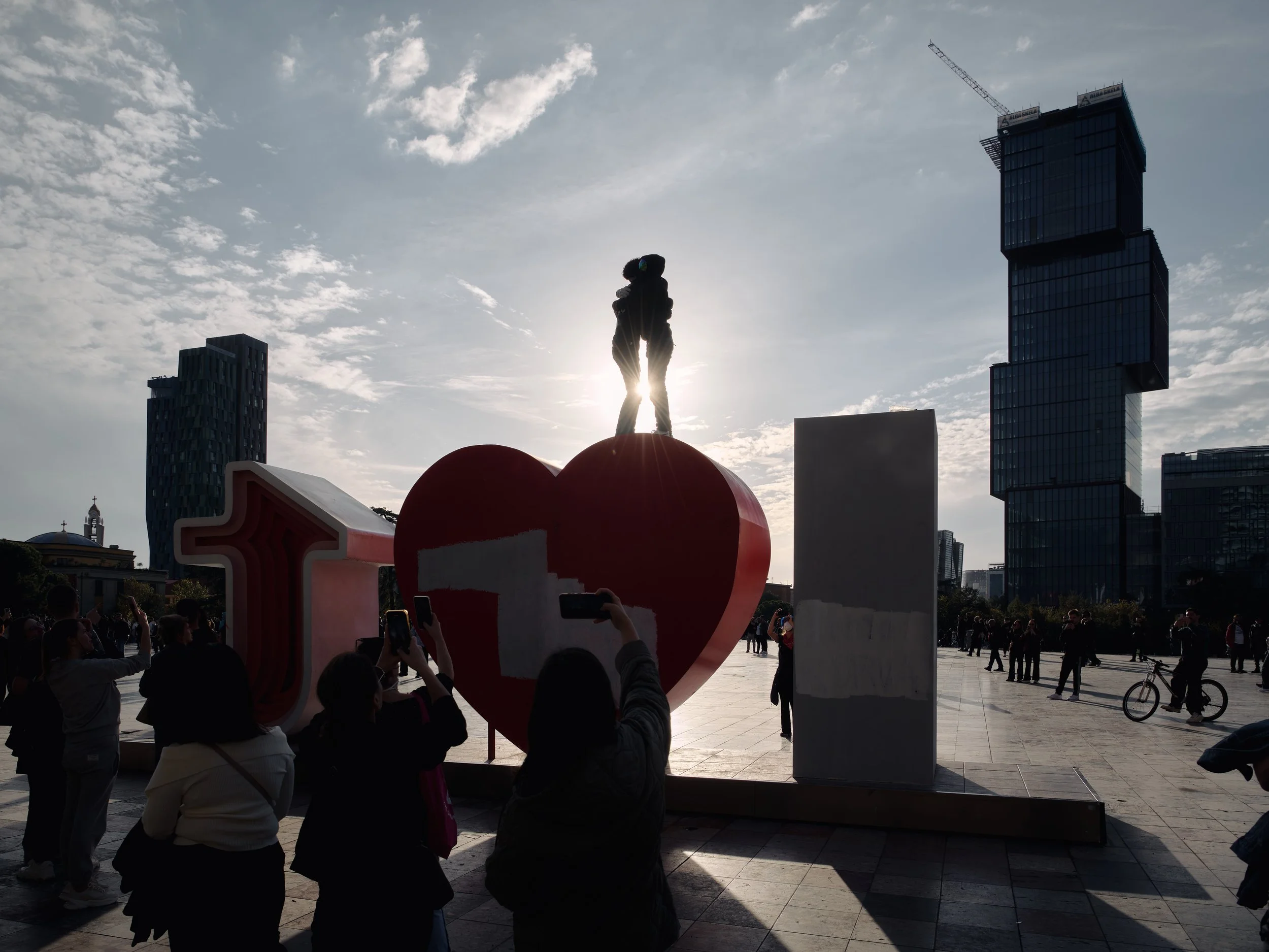 Two students embrace, placing their hands over their hearts, a gesture that has become a recurring symbol of the protests and their circulation on social media.