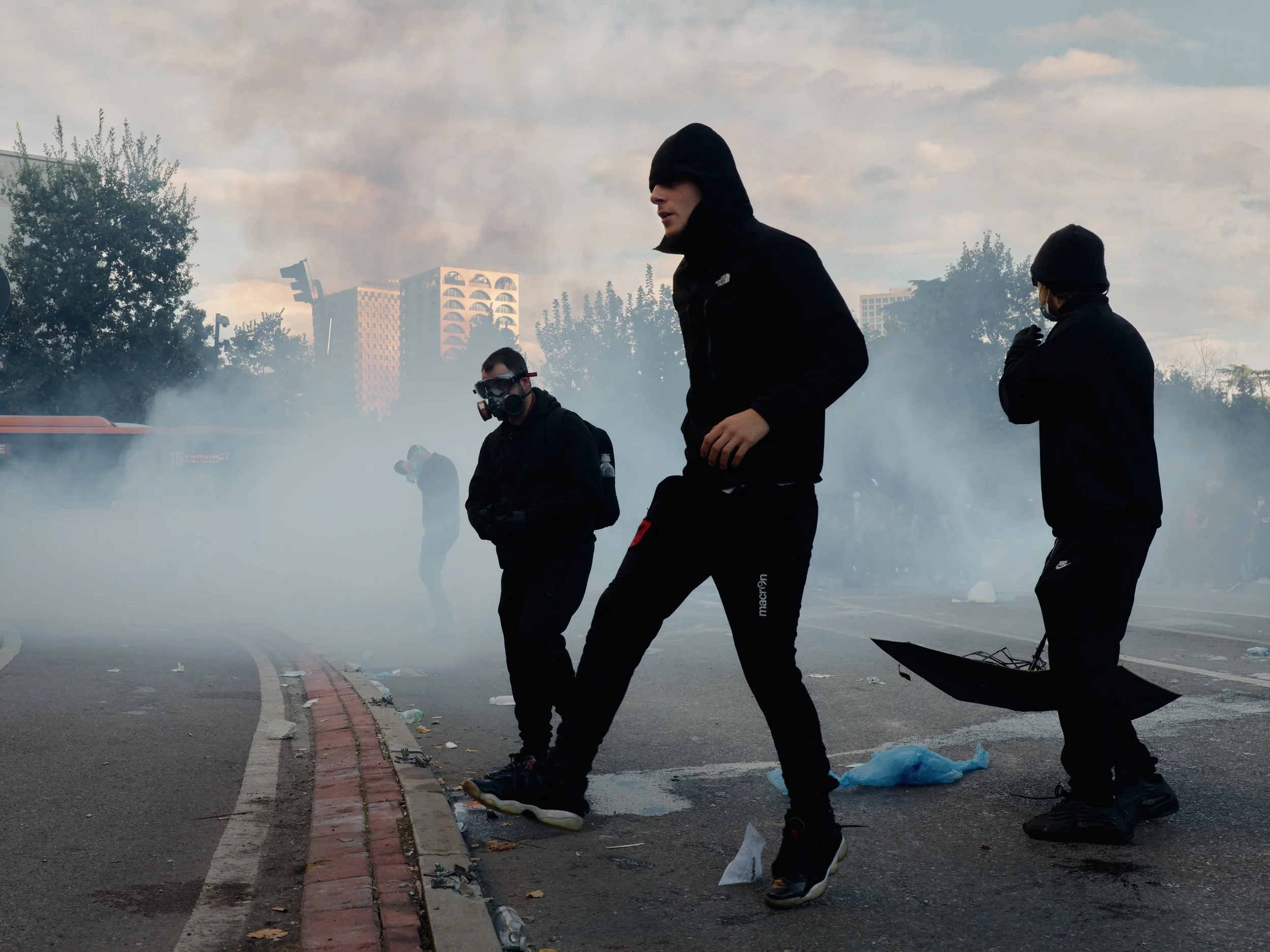 Students move away from tear gas during the protest.