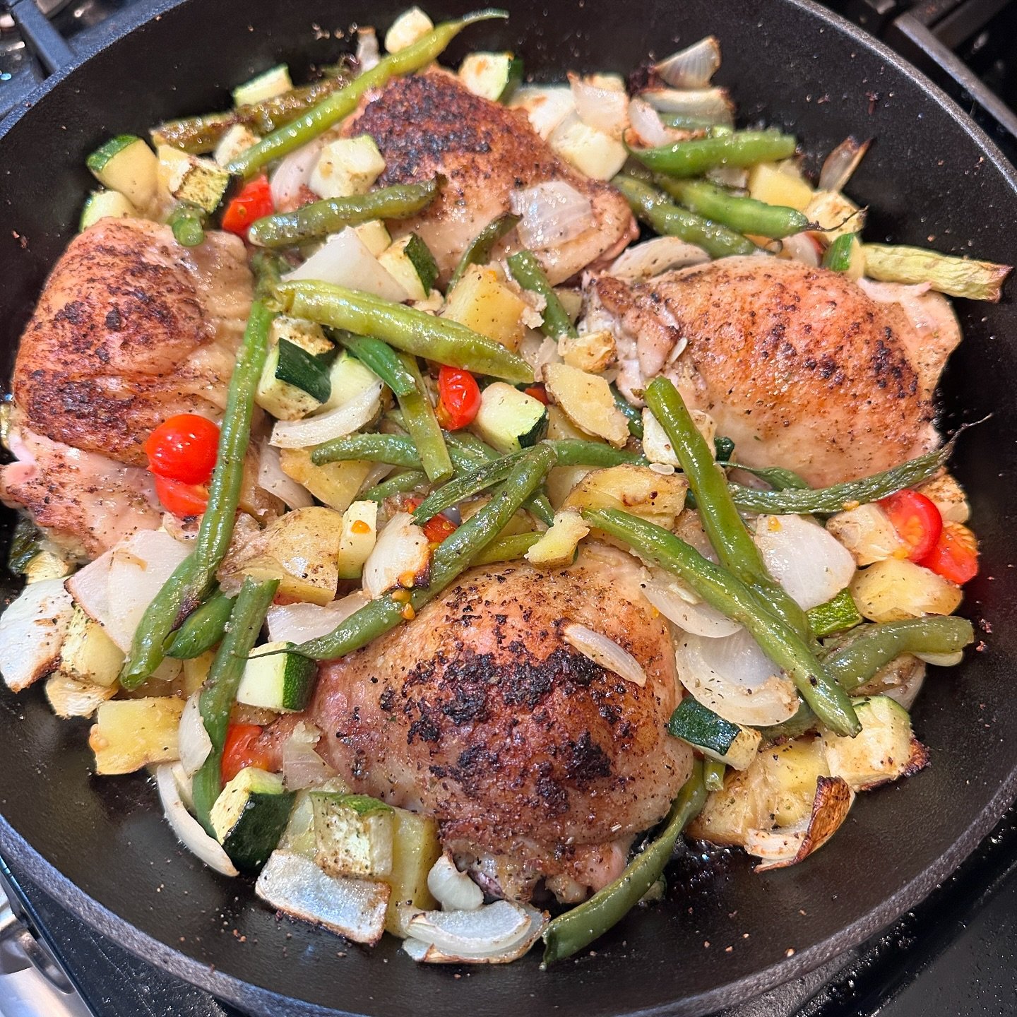 Tasty Tuesday: Skillet Chicken + Garden Veggie bake

Heat up an oven safe pan on the stove. 
Add fat of choice.
Dry rub 4 chicken thighs (mine are bone in) with your favorite spice mix. 
Sear chicken on one side until brown 3-4 minutes. 
Once you fli