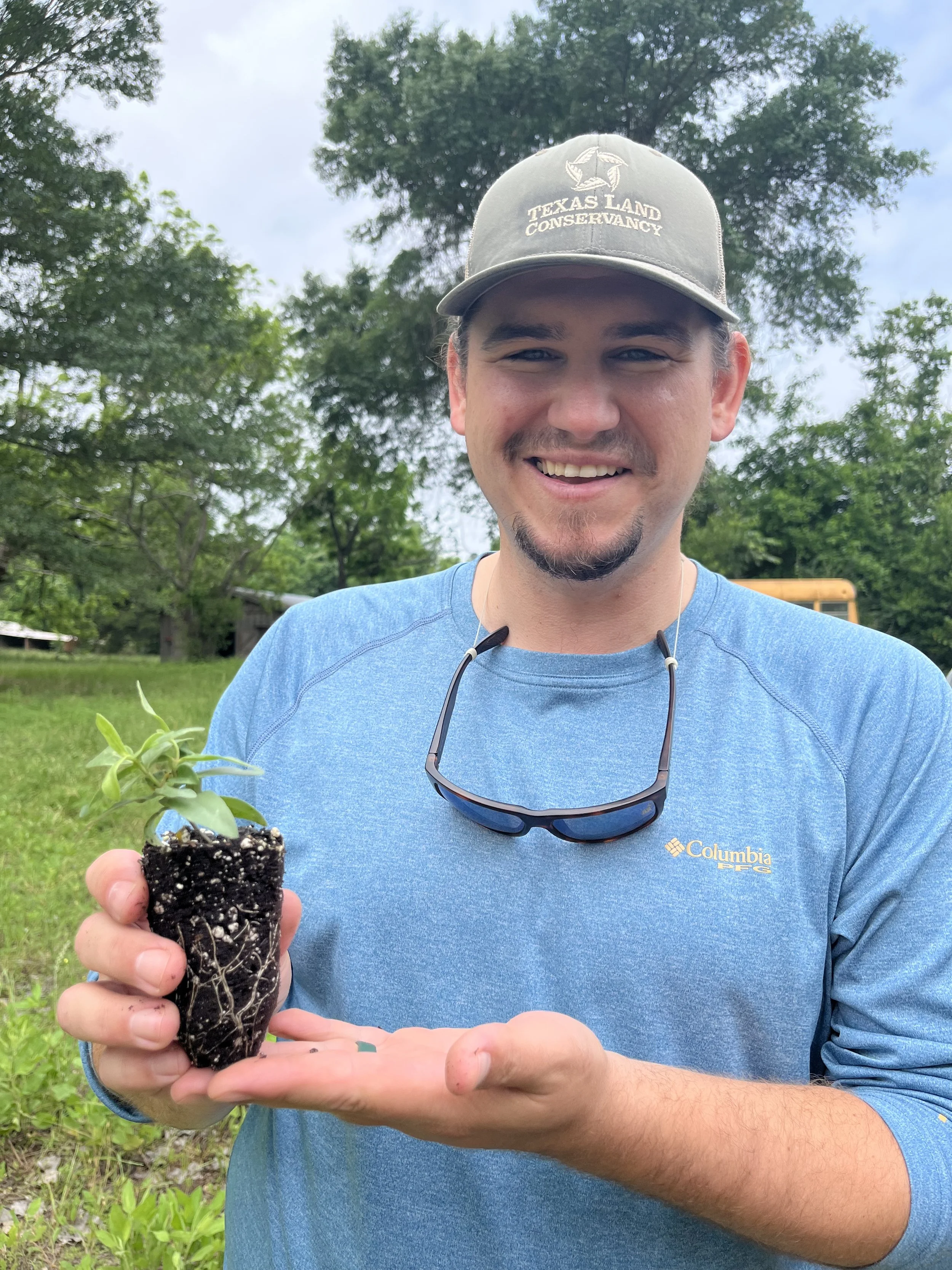 Jack holding a milkweed plug.