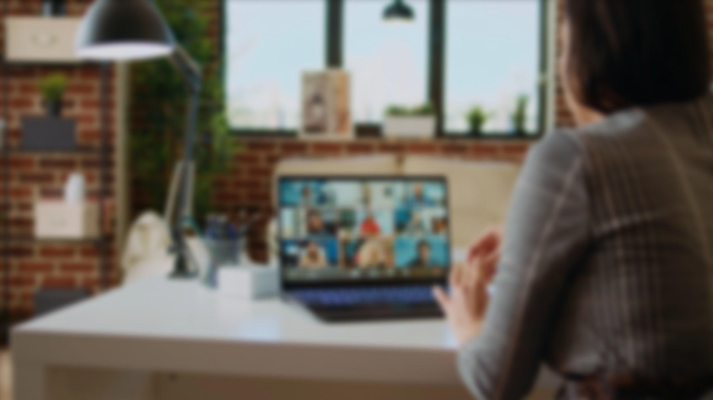 Blurred image of a person on a video conference call.