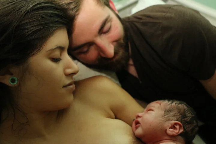 momanddadinbedwithbaby.jpg