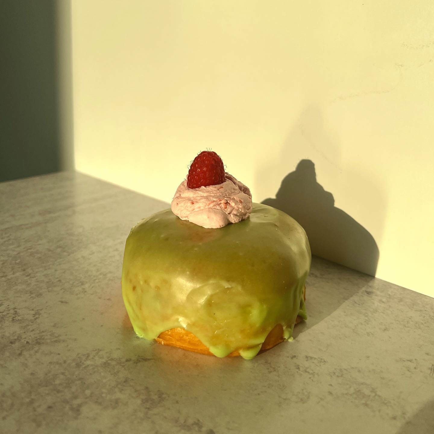 Golden hour shot of our new raspberry matcha donut - filled w/ raspberry jelly &amp; matcha pastry cream. Available today &amp; all throughout July!