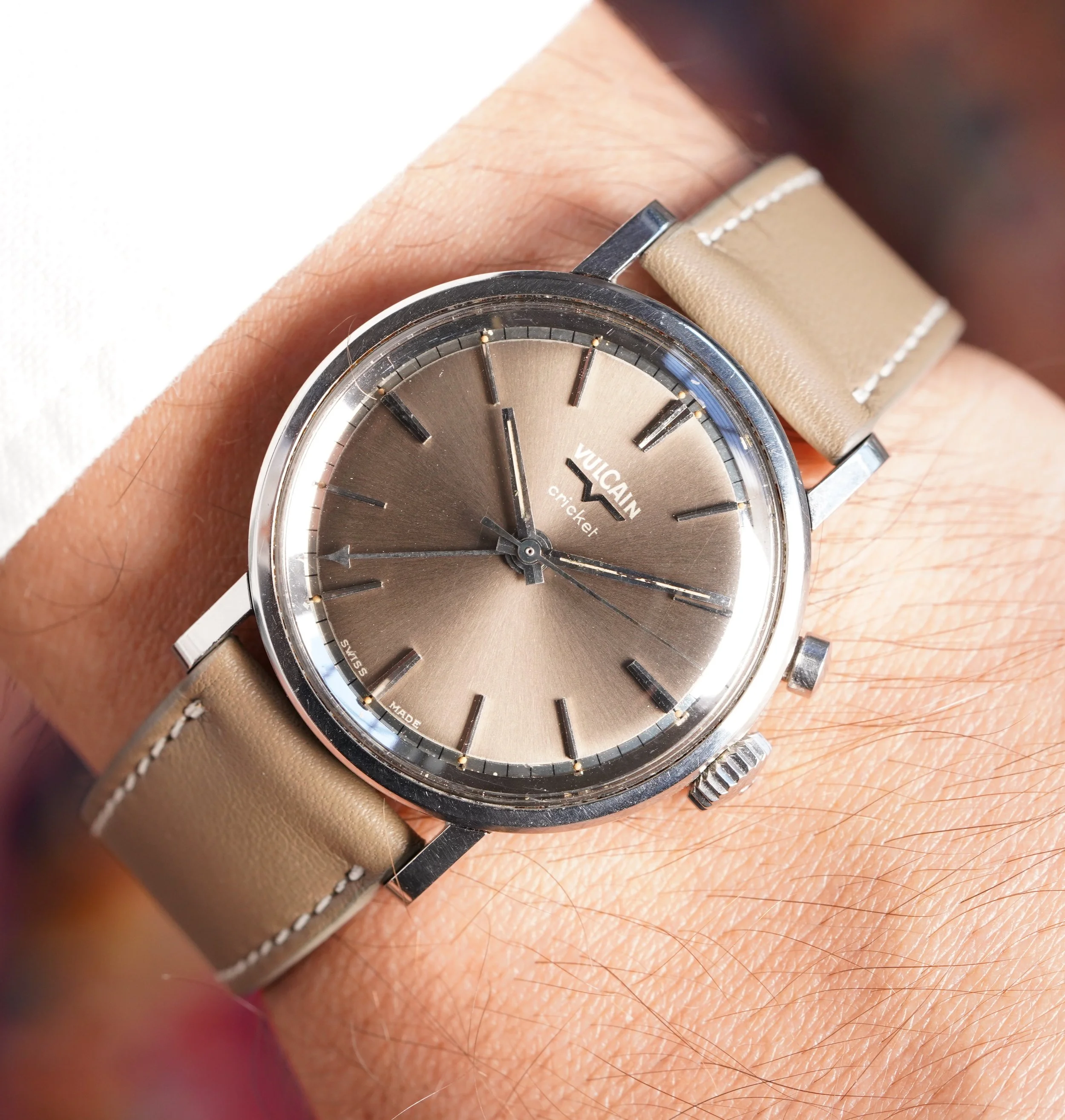 Vintage Vulcain Cricket reference S2324A w/ a metallic grey dial, minus the “Waterprotected” font.