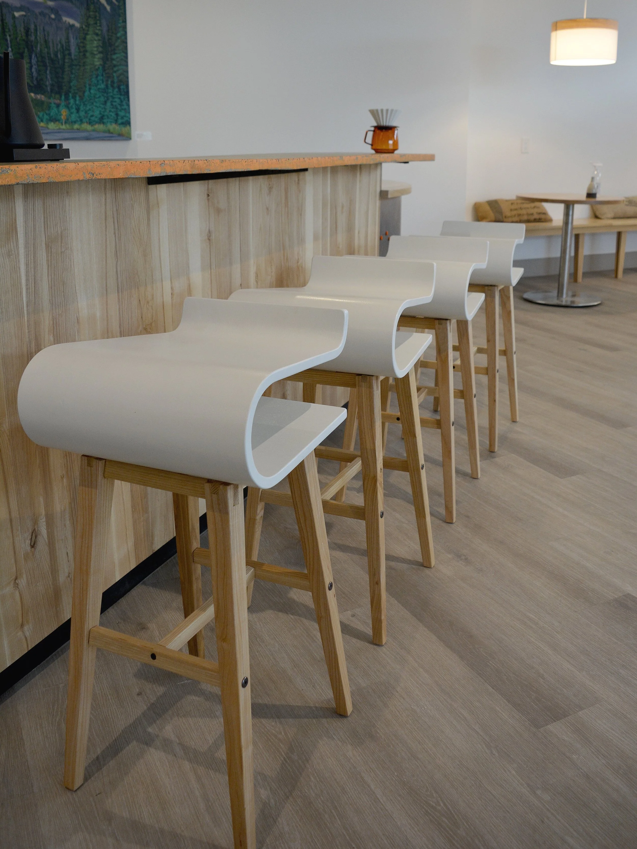 Side profile of Float Barstool, highlighting bouncy flexibility and ergonomic design, layered veneer construction by Ashley J MacDonald