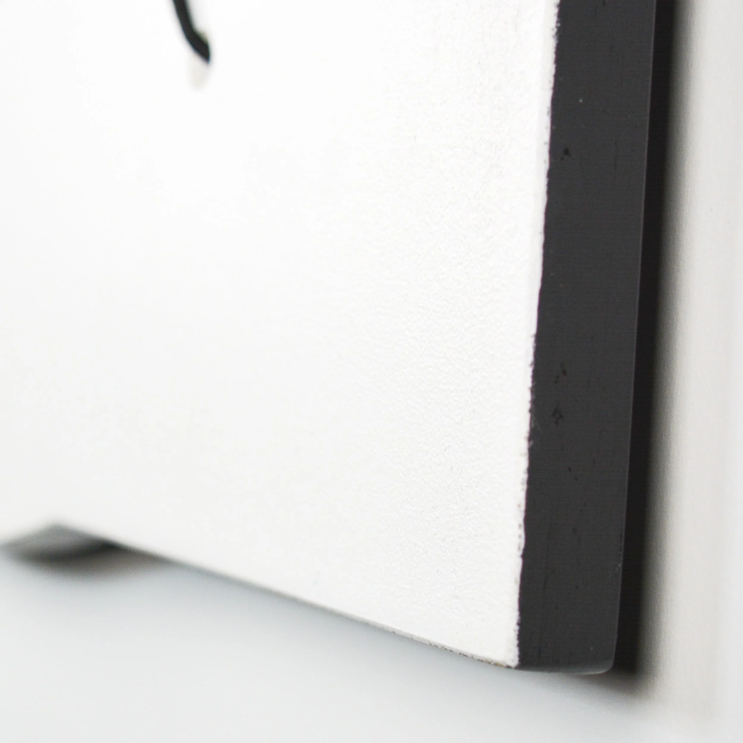 Detail of Word Bubble, Birch painted in striking Black and White, by Ashley J MacDonald