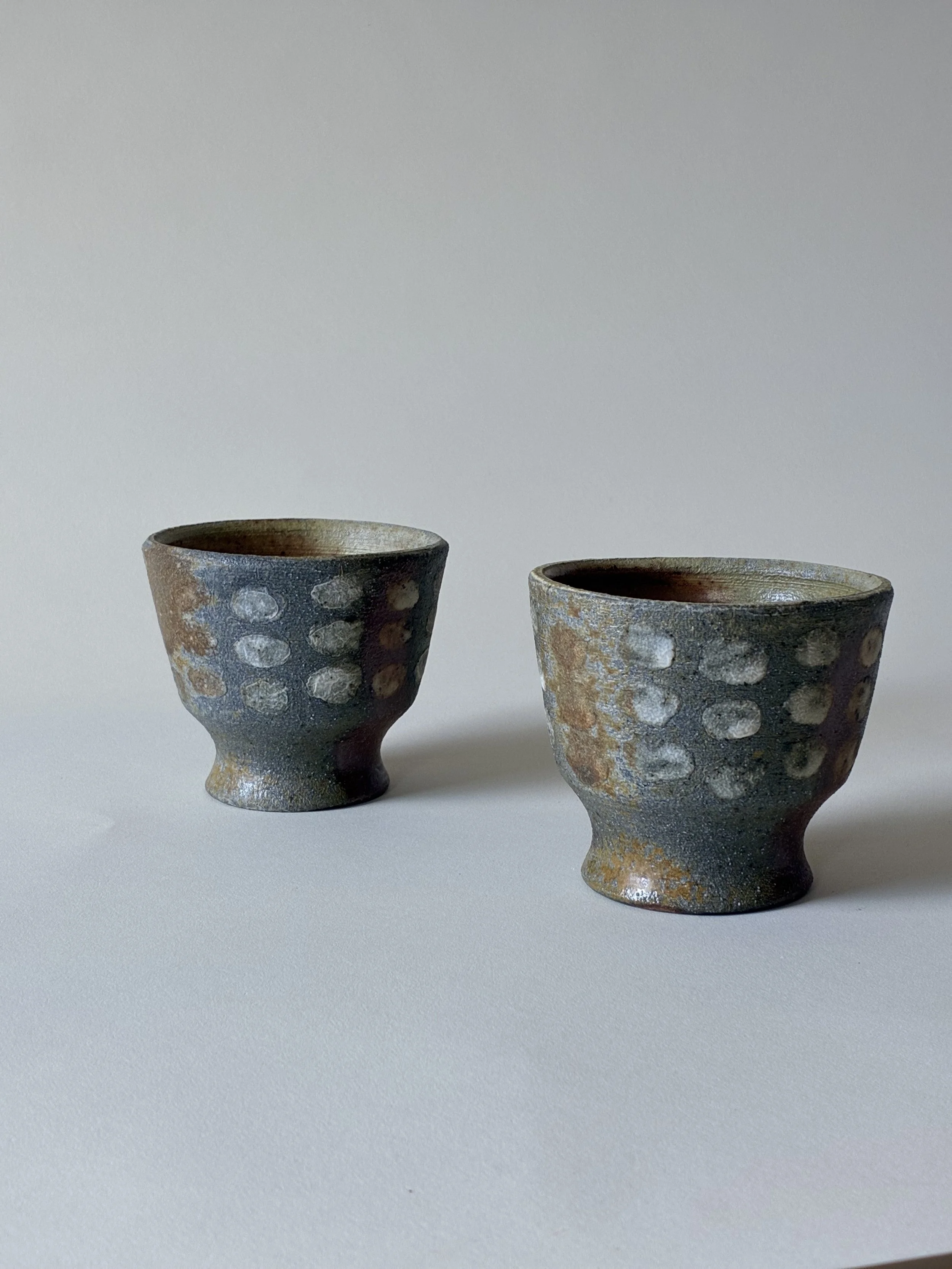 Twin cups with cloud motif