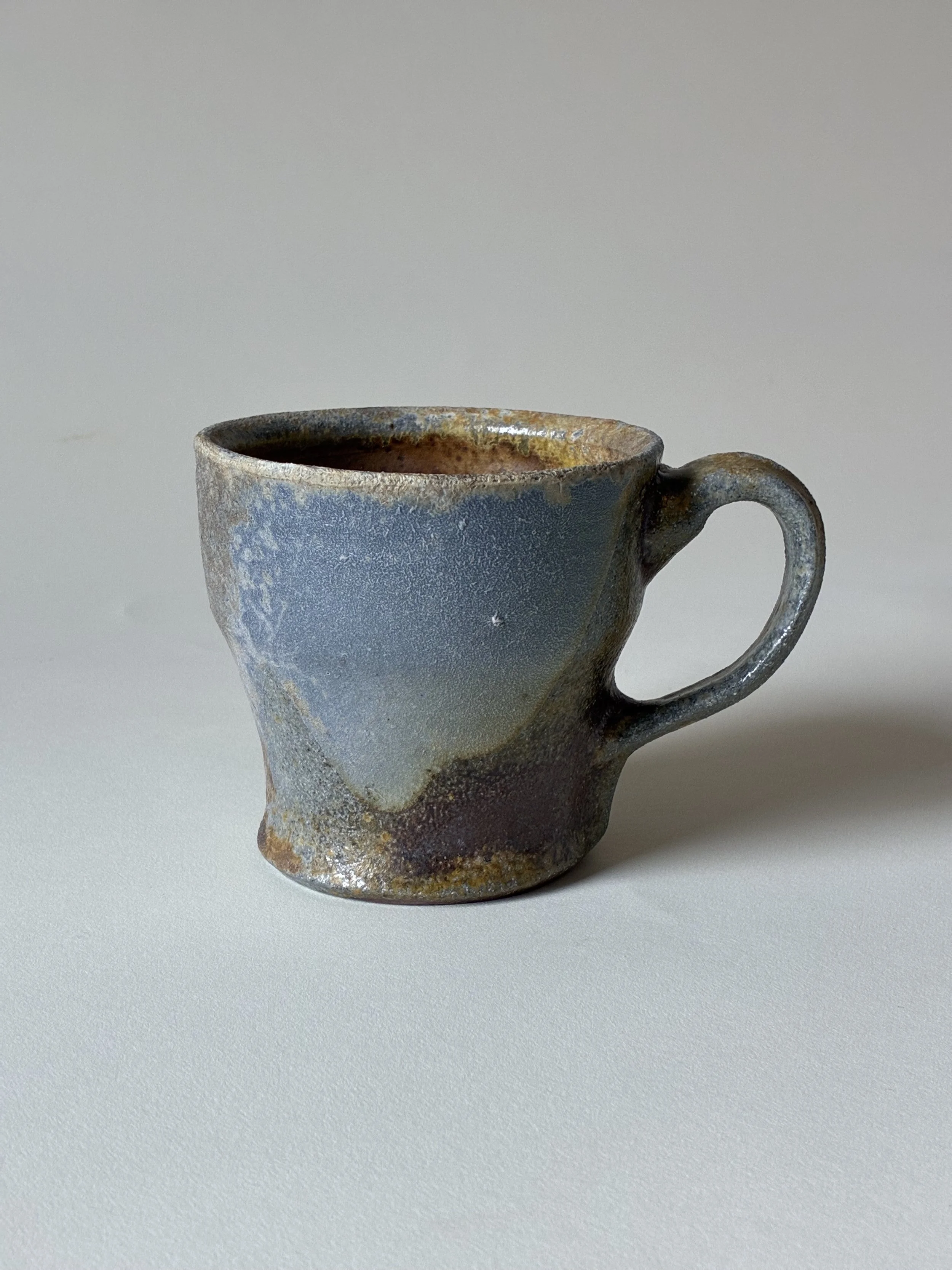 Stoneware mug with porcelain slip decoration