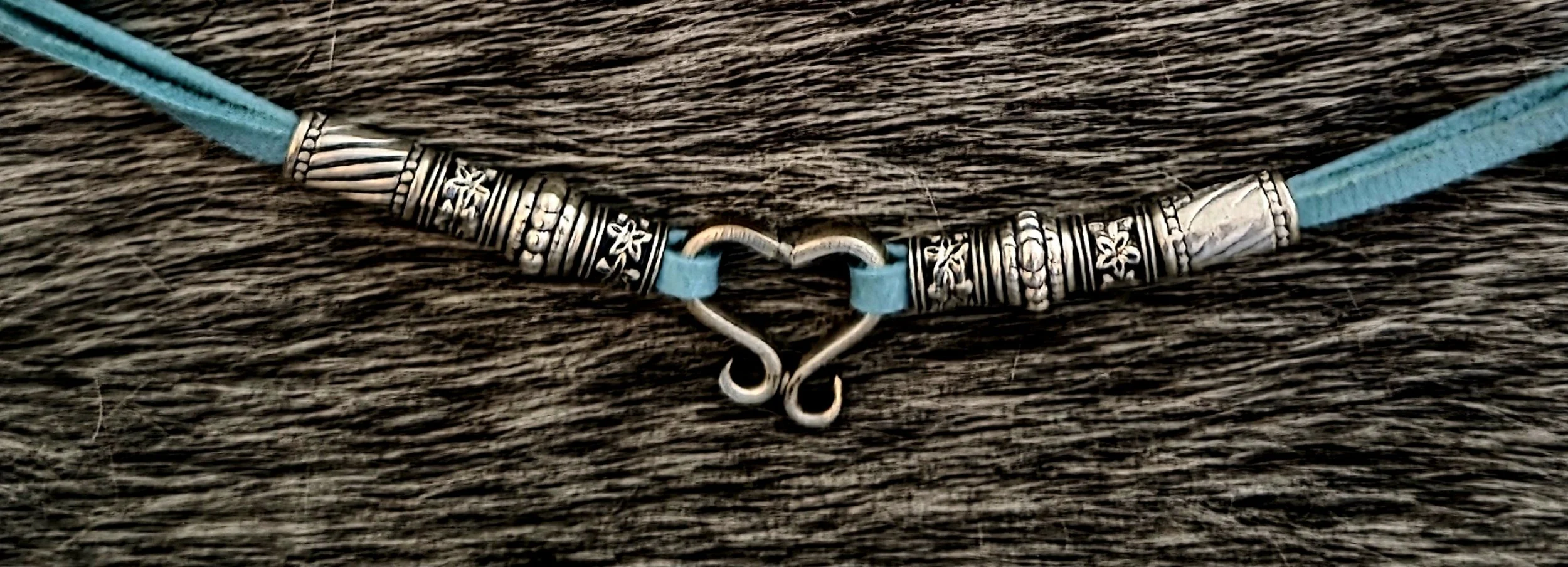 Hill Country Heart Bracelet, handcrafted from two fork tines. This artisan piece pairs repurposed silverware with turquoise leather. Repurposed, upcycled In God We Trust fun!