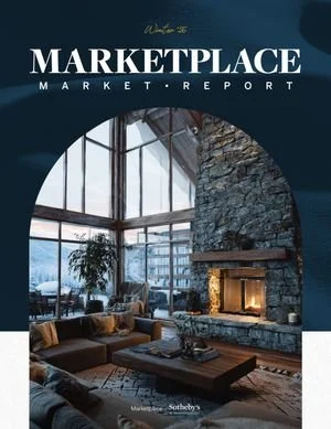 A wintery scene as viewed from a window inside a cozy home.