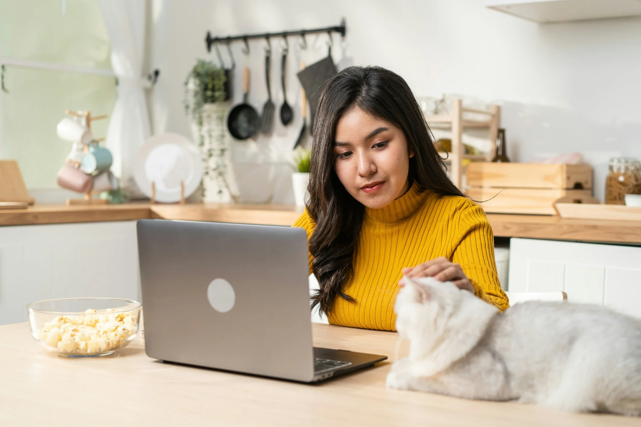 Portland client joining online EMDR therapy from home while petting her cat