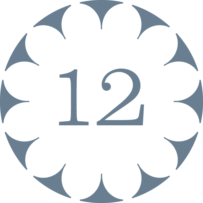 A decorative clock face with large numbers 1 and 2, featuring a scalloped circular border with alternating dark and light segments.