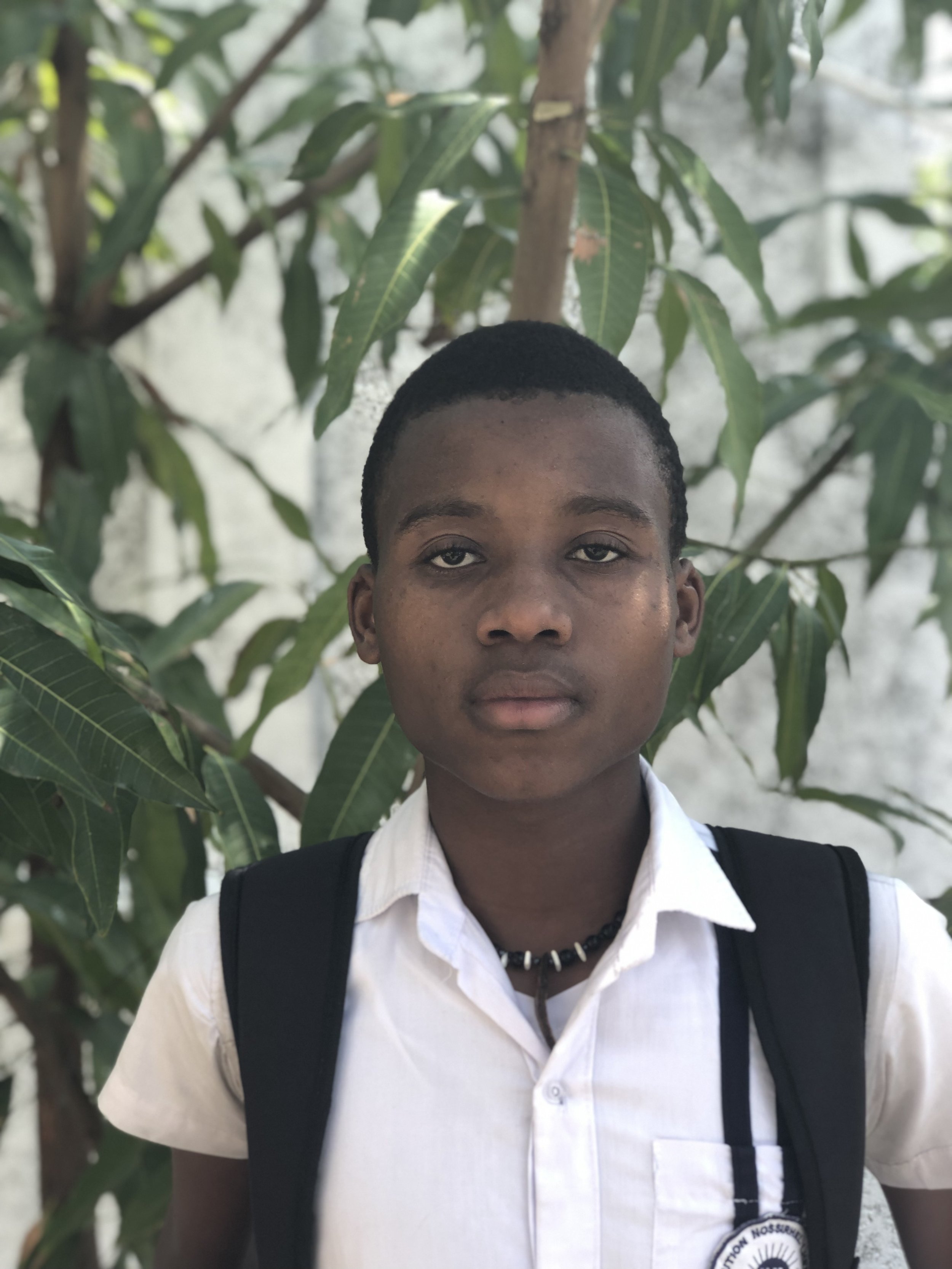 Martelly (18),
At his mother's request, Martelly was bought to the center in 2008. He is reserved except when he’s playing soccer and other competitive games such as dominoes. His current interest aligns with wanting to be an electrician.