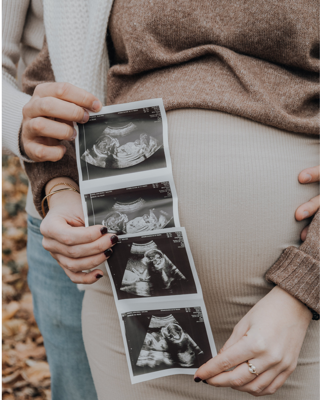 Expecting family with baby bump and ultrasound pictures