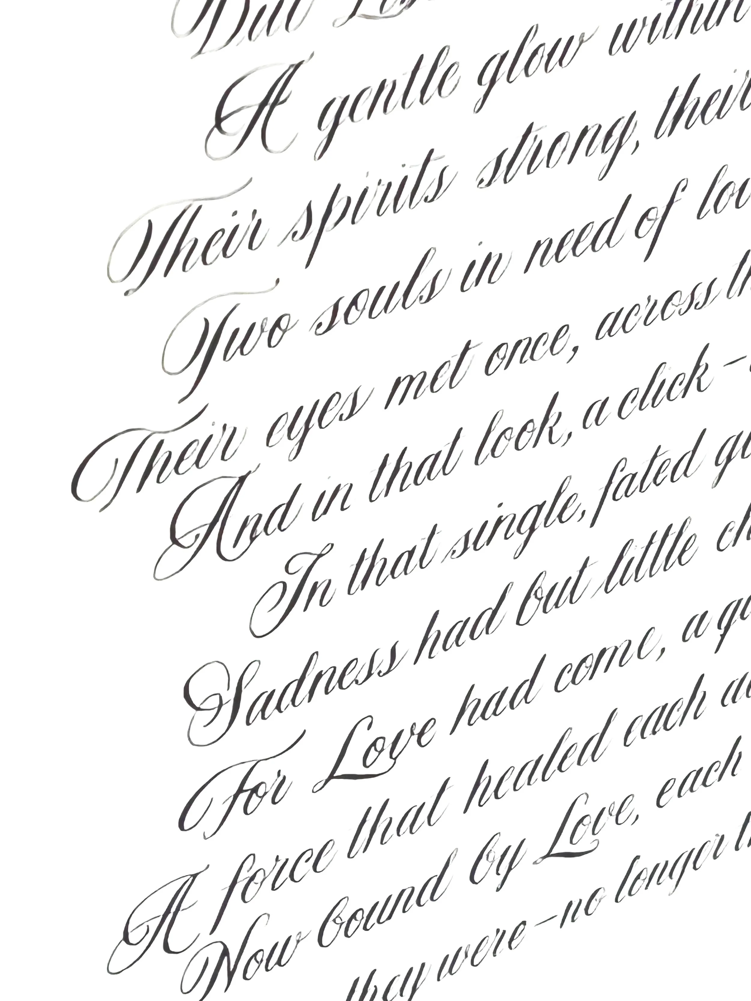 Close-up of a handwritten letter in elegant cursive on white paper.
