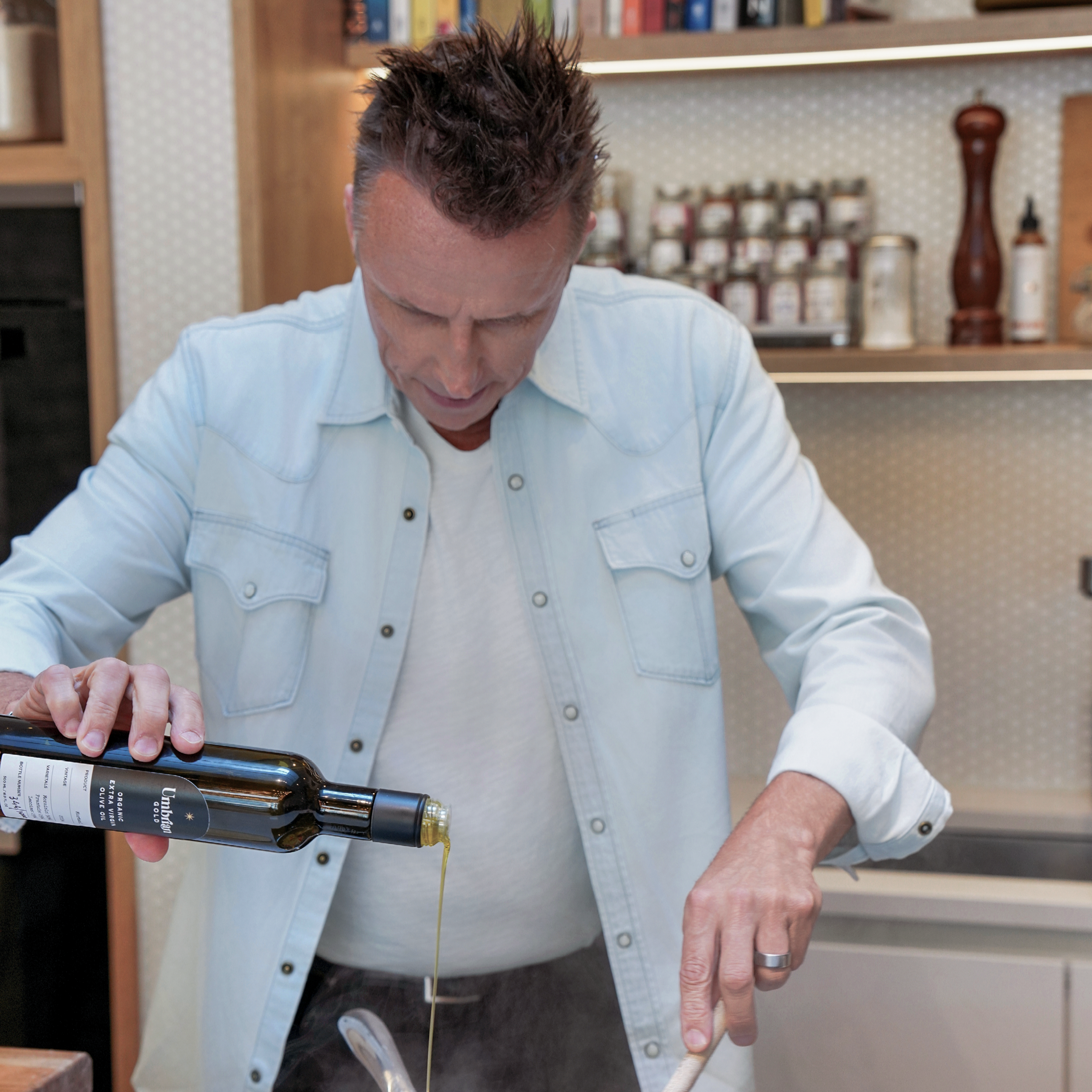 Chef Marc Murphy cooking with his extra virgin olive oil